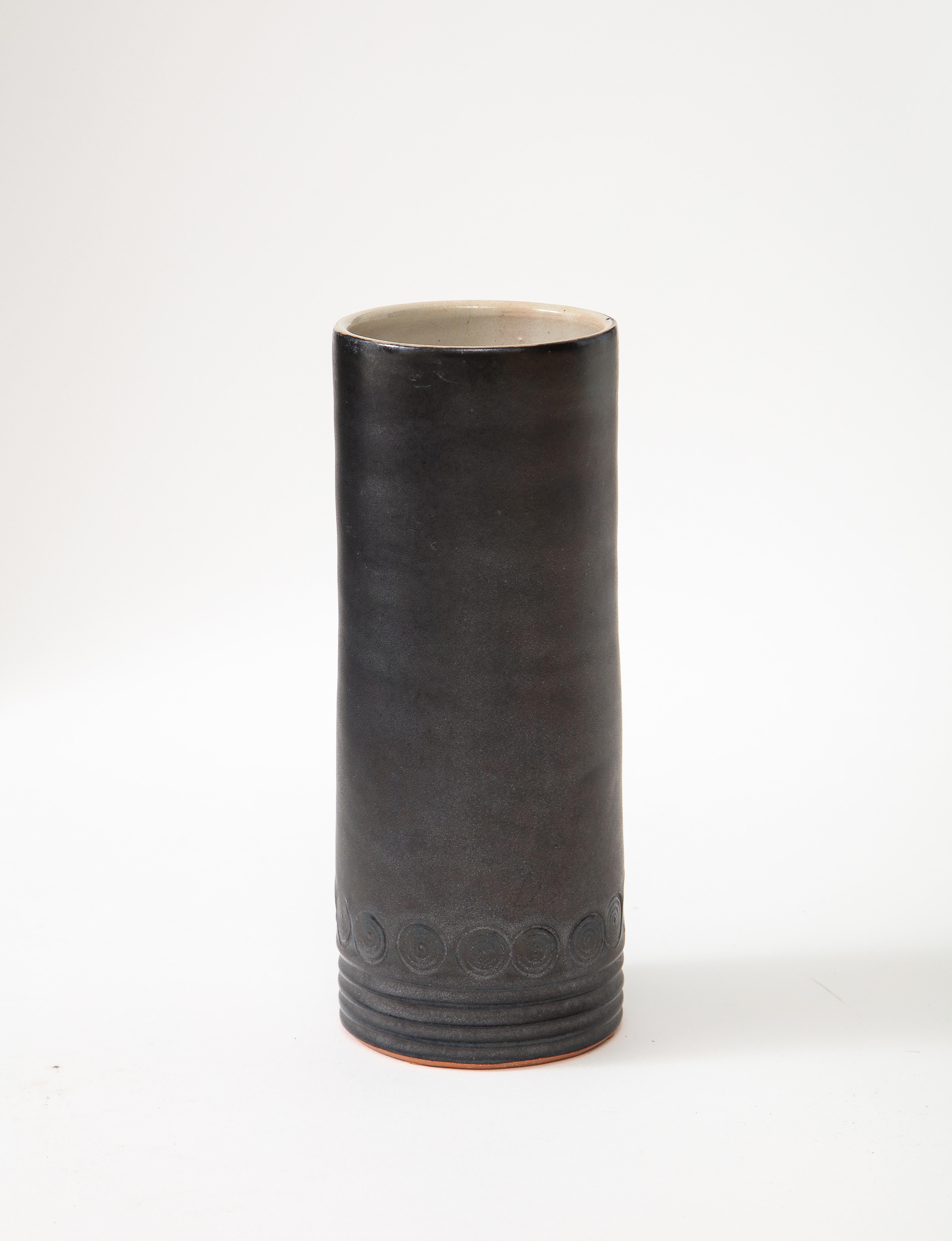 Matte black mid century vase with white interior, incised circle & line decoration, France, c. 1950
Measures: Measure: H: 7.75.