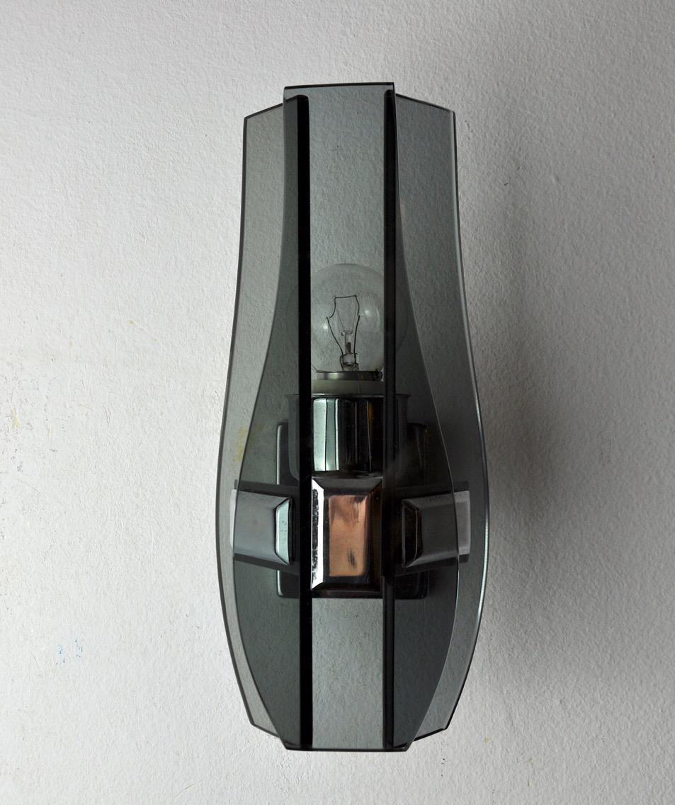 Very beautiful veca wall lamp produced in italy in the 70s. Wall lamp made up of black cut glass plates and a chrome structure. Unique object that will illuminate wonderfully and bring a real design touch to your interior. Electricity checked, mark