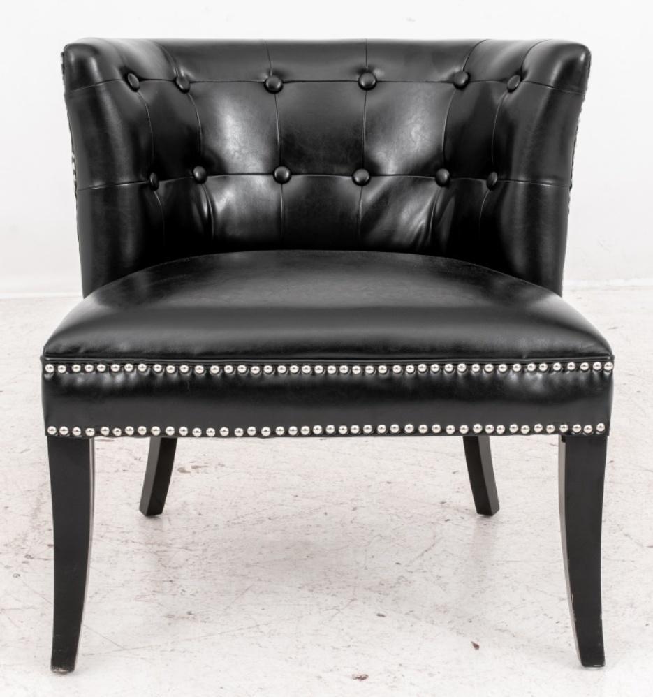 Modern black vegan leather upholstered with buttoned backrest and studded neoclassical motif to arms, raised on ebonized wood sabre legs.

Dealer: 138XX.