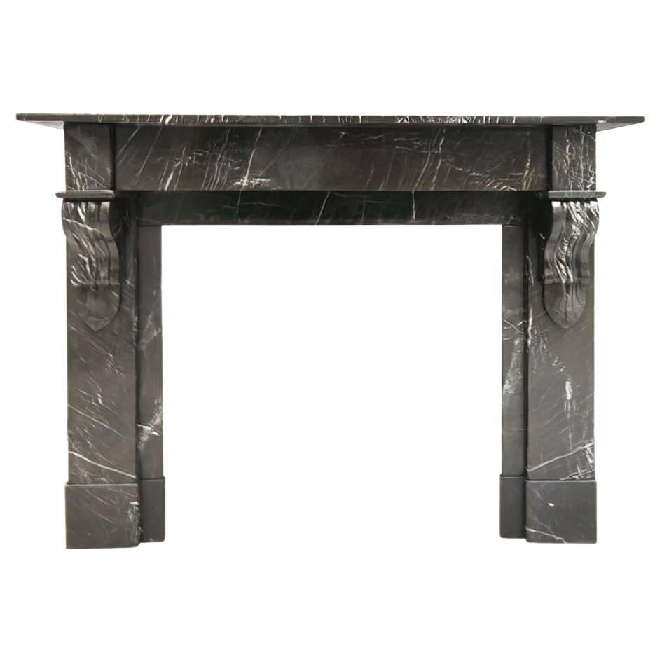 Black-veined marble Modillion fireplace mantel early 20th Century For Sale