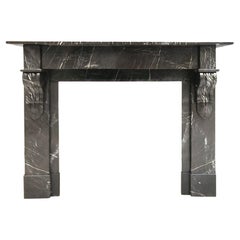 Antique Black-veined marble Modillion fireplace mantel early 20th Century