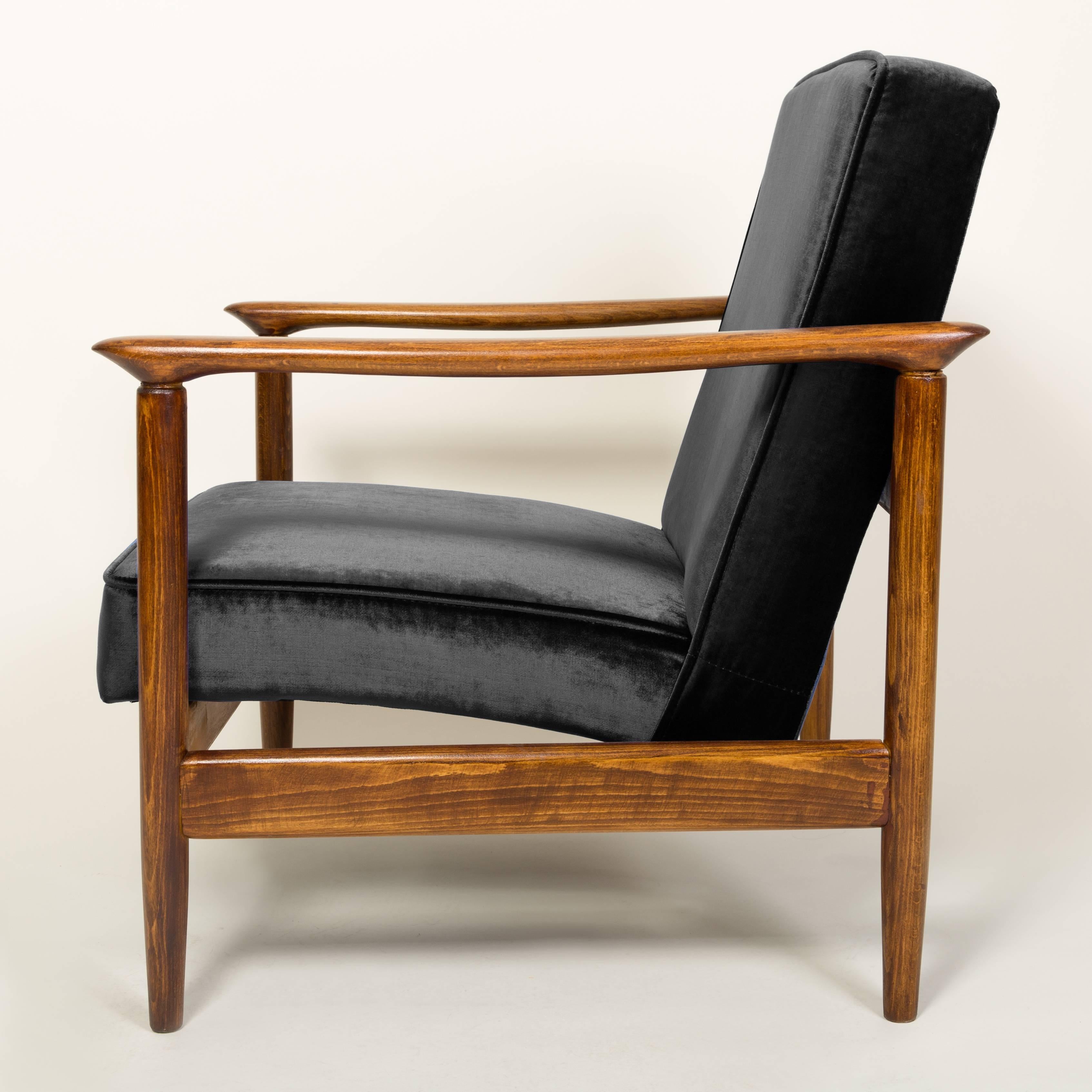 Beautiful armchair model GFM-142, designed by Edmund Homa. The armchair was made in the 1960s in the Gosciecinska Furniture Factory. Frame is made from solid beech wood. The GFM-142 armchair is regarded one of the best Polish armchair design from