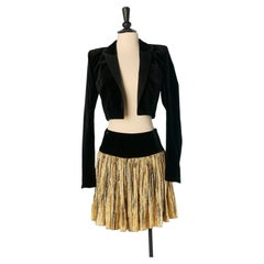 Black velvet boléro and gold pleated skirt ensemble ALEXANDRE VAUTHIER COUTURE