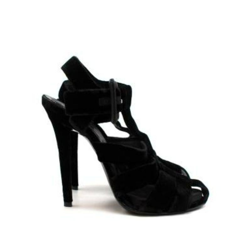 Roger Vivier Black Velvet Caged Heeled Sandals
 
 - Caged black velvet sandals set on a 135mm heel 
 - Large buckle fastening around the ankle 
 - Branded leather insole 
 - Small interior platform
 
 Materials 
 Velvet 
 Leather 
 
 Made in Italy 
