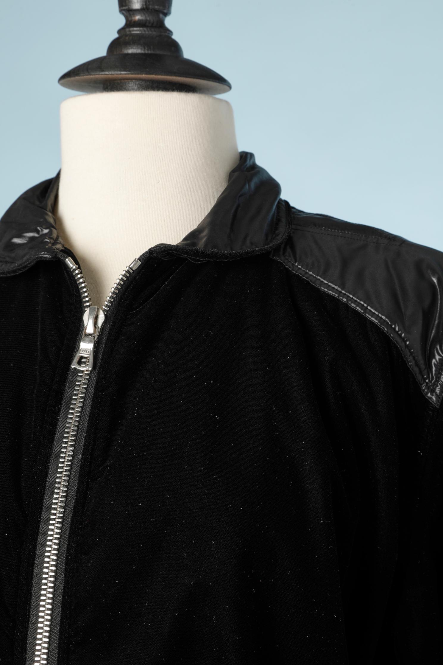 Black velvet jacket with zip. Black polyester insert on the shoulders, cuffs and middle back ( waist band)