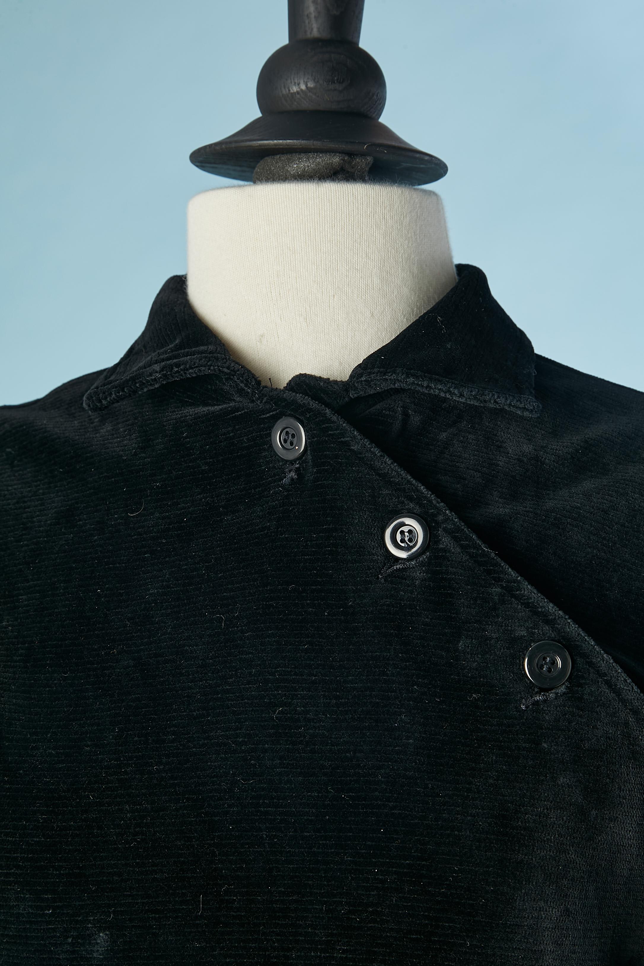 Black velvet jumpsuit with asymmetrical button placket . Fabric composition: 72% cotton, 25% polyester, 3% stretch. Pocket lining: 100% nylon. 
Drawstring belt 
SIZE 36 / S 