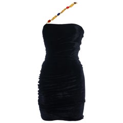 Black velvet ruched mini dress with a jewelled gold chain shoulder strap, 1990