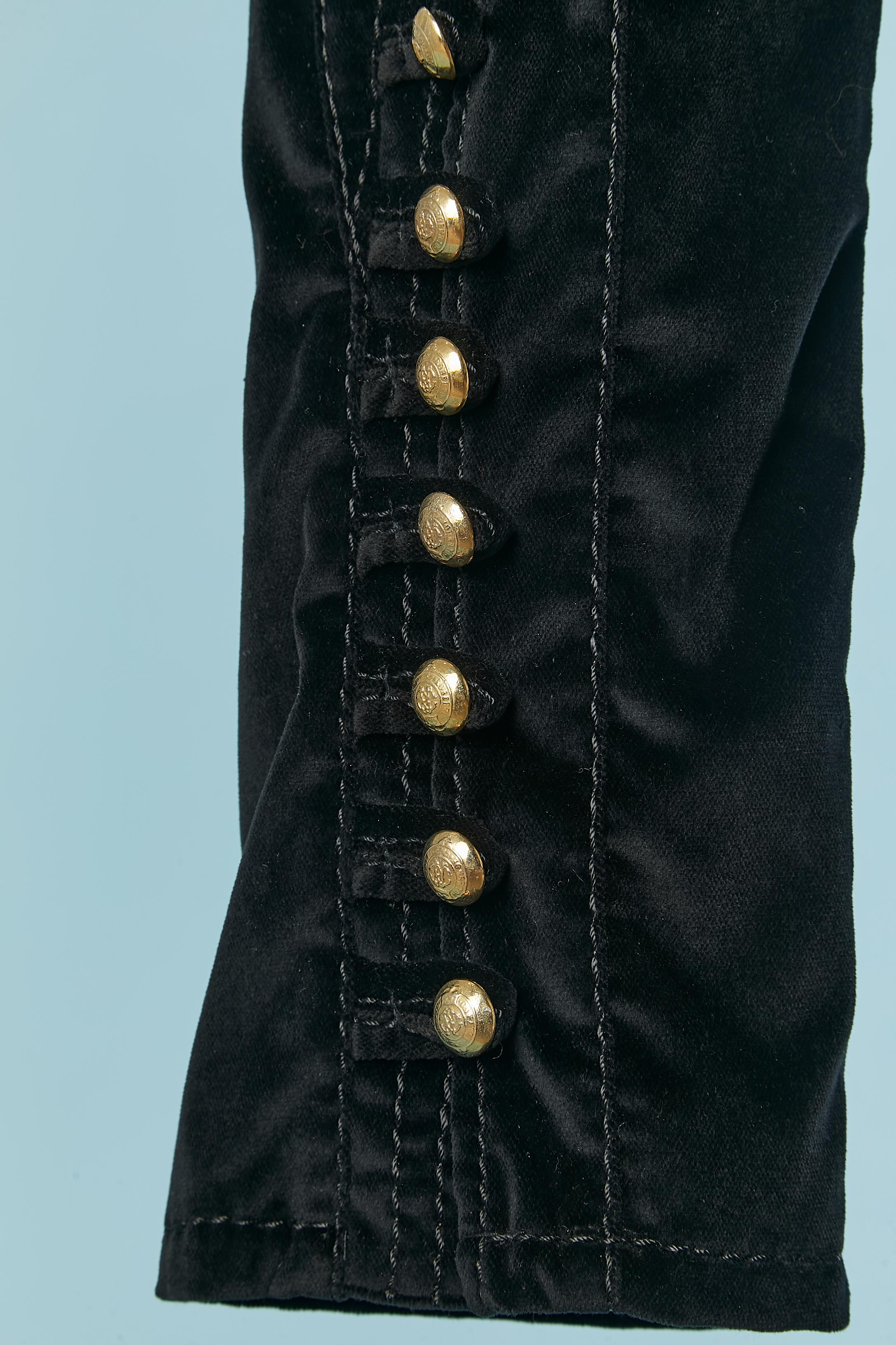 Black velvet ( 98% cotton, 2% stretch) short trousers with gold metal buttons and buttonhole on the bottom side of each legs. Cotton lining with leopard print. Cut-work. Top-stitched. Zip and hook&eye closure on the top middle front. Branded gold