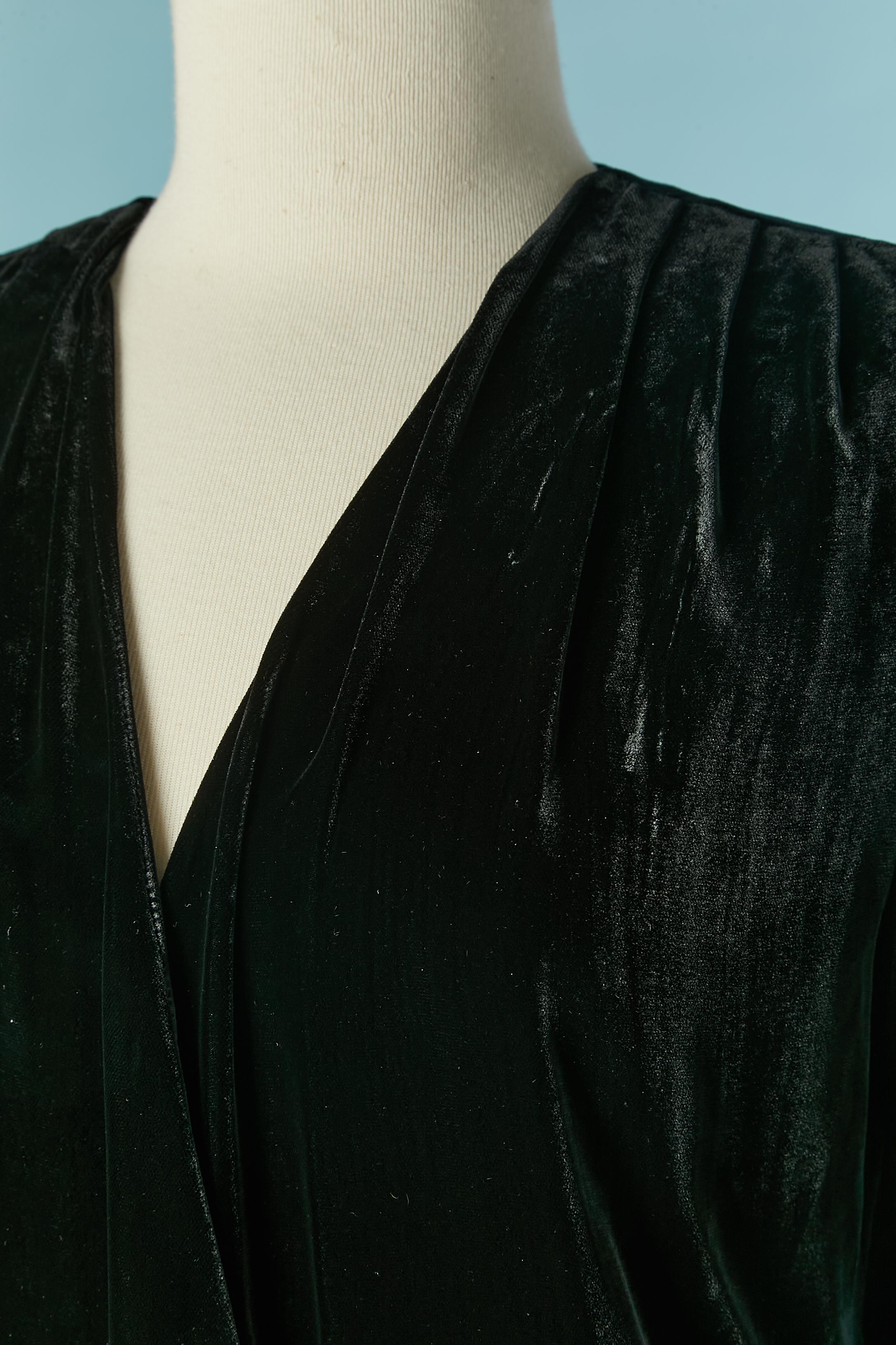 Black velvet wrapped cocktail dress with white pocket flap (fake pocket) and decorative button. Main fabric composition: 74% rayon, 14%cotton, 12% silk. Silk lining. 
Snap and hook&eye closure on the middle front. 
SIZE 38 (Fr) but can fit 40 (Fr) 