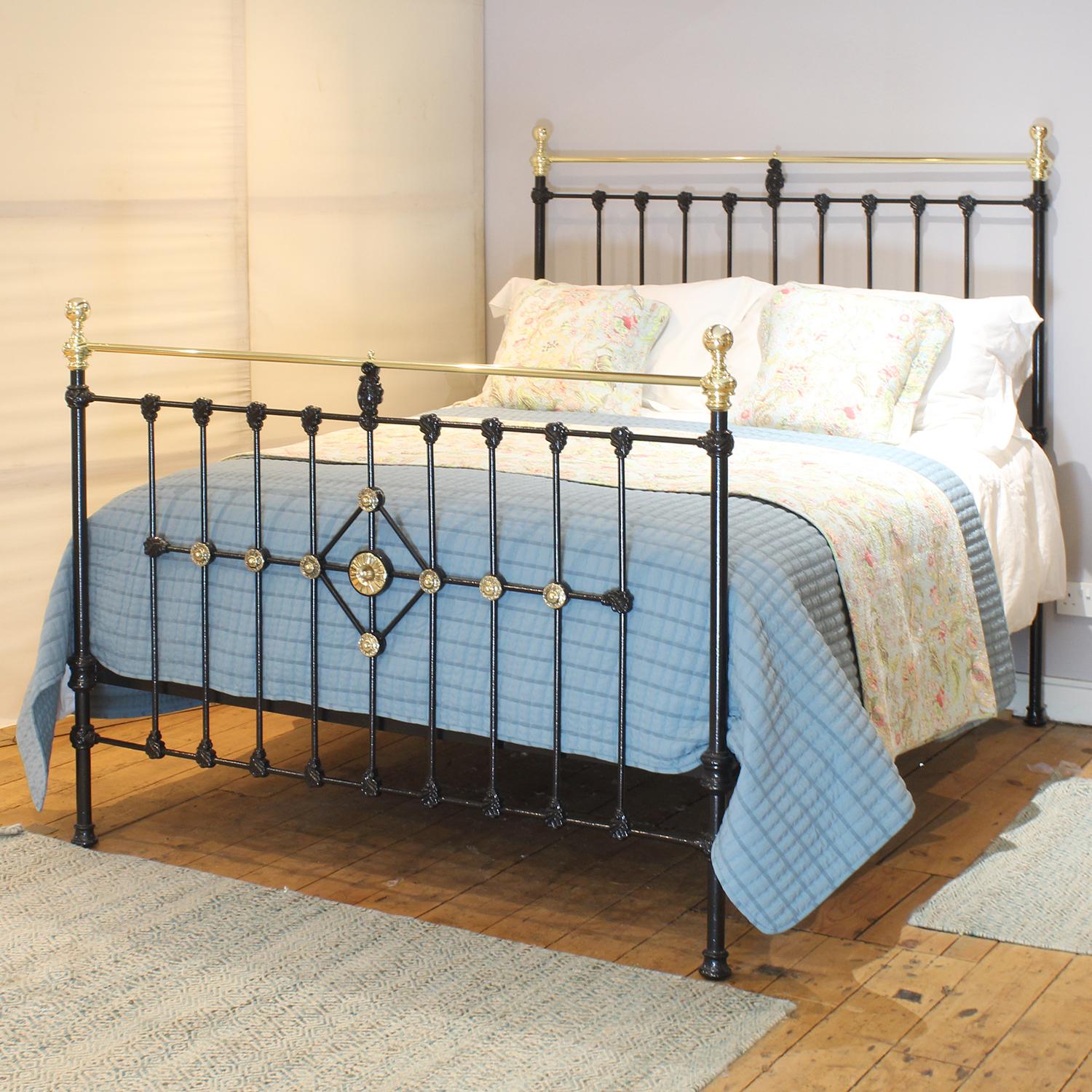 An attractive cast iron Victorian antique bed finished in black with rosette decoration on the foot panel.

This bed accepts a UK king size or US queen size (5ft, 60in or 150cm wide) base and mattress set.

The price includes a standard firm bed