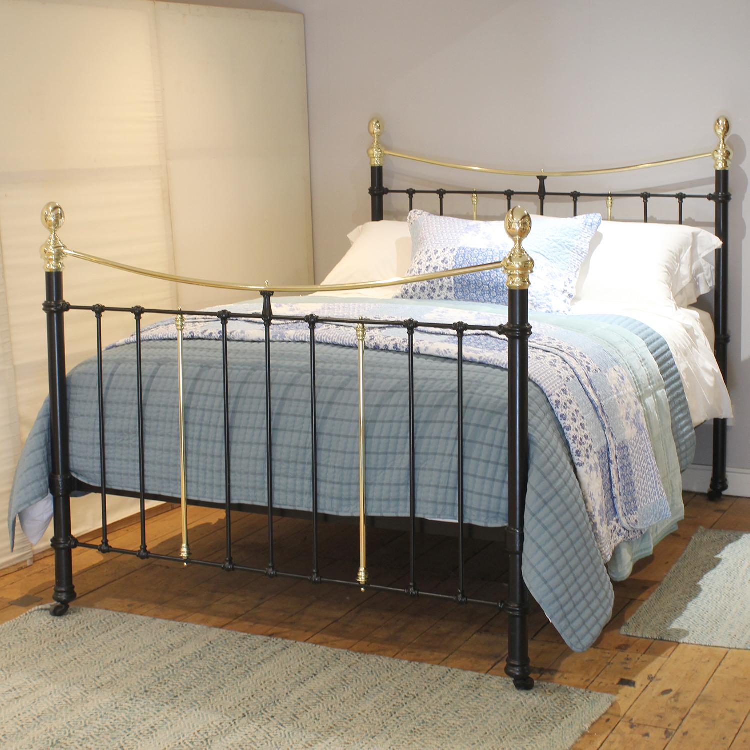 An attractive cast iron Victorian antique bed finished in black with curved brass top rails and decorative castings.
This bed has the original castors, which can be removed if required.

This bed accepts a UK king size or US queen size (5ft, 60in or