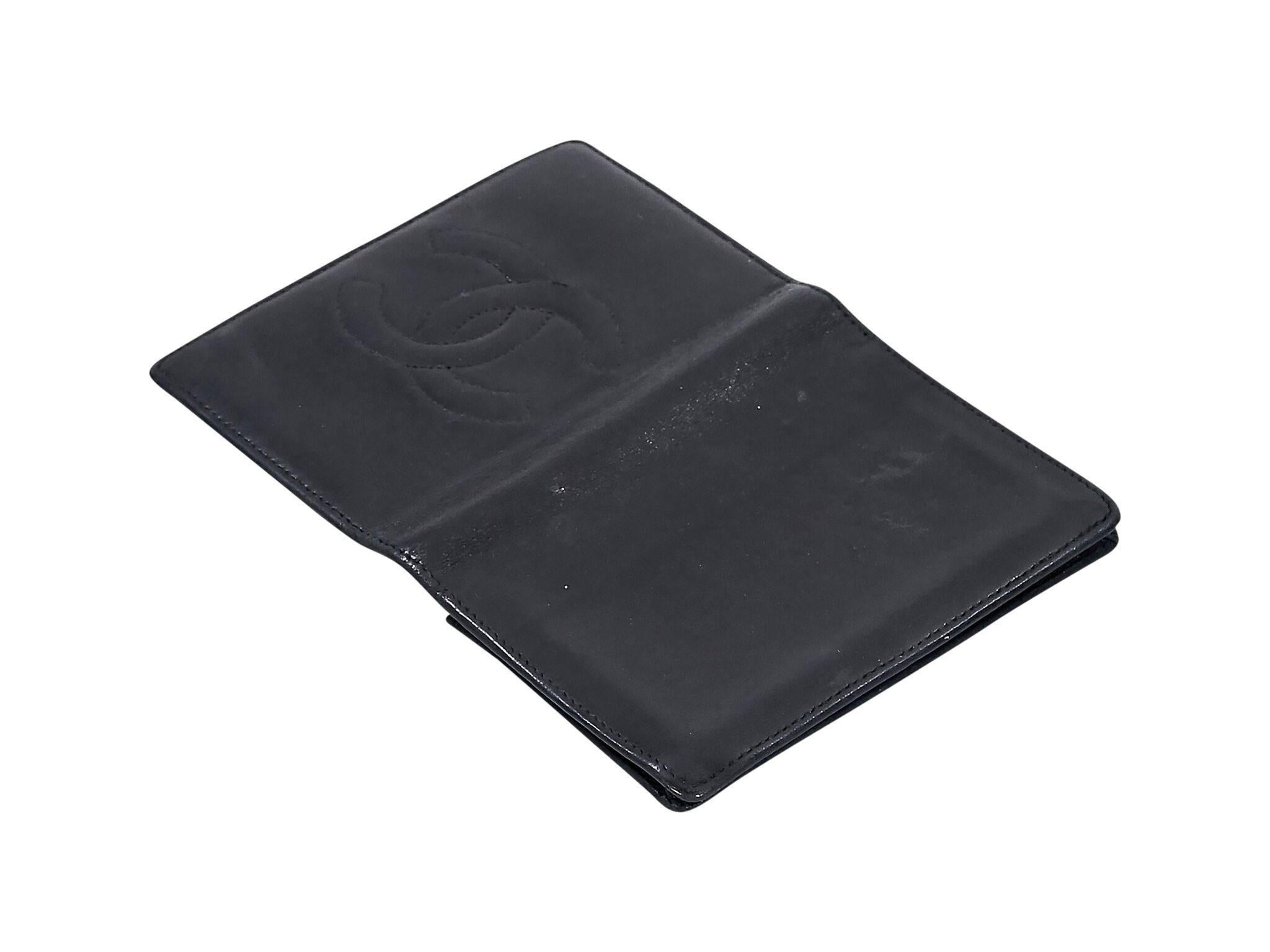 Product details:  Vintage black leather credit card holder by Chanel.  Multiple inner credit card slots and slide pockets.  3