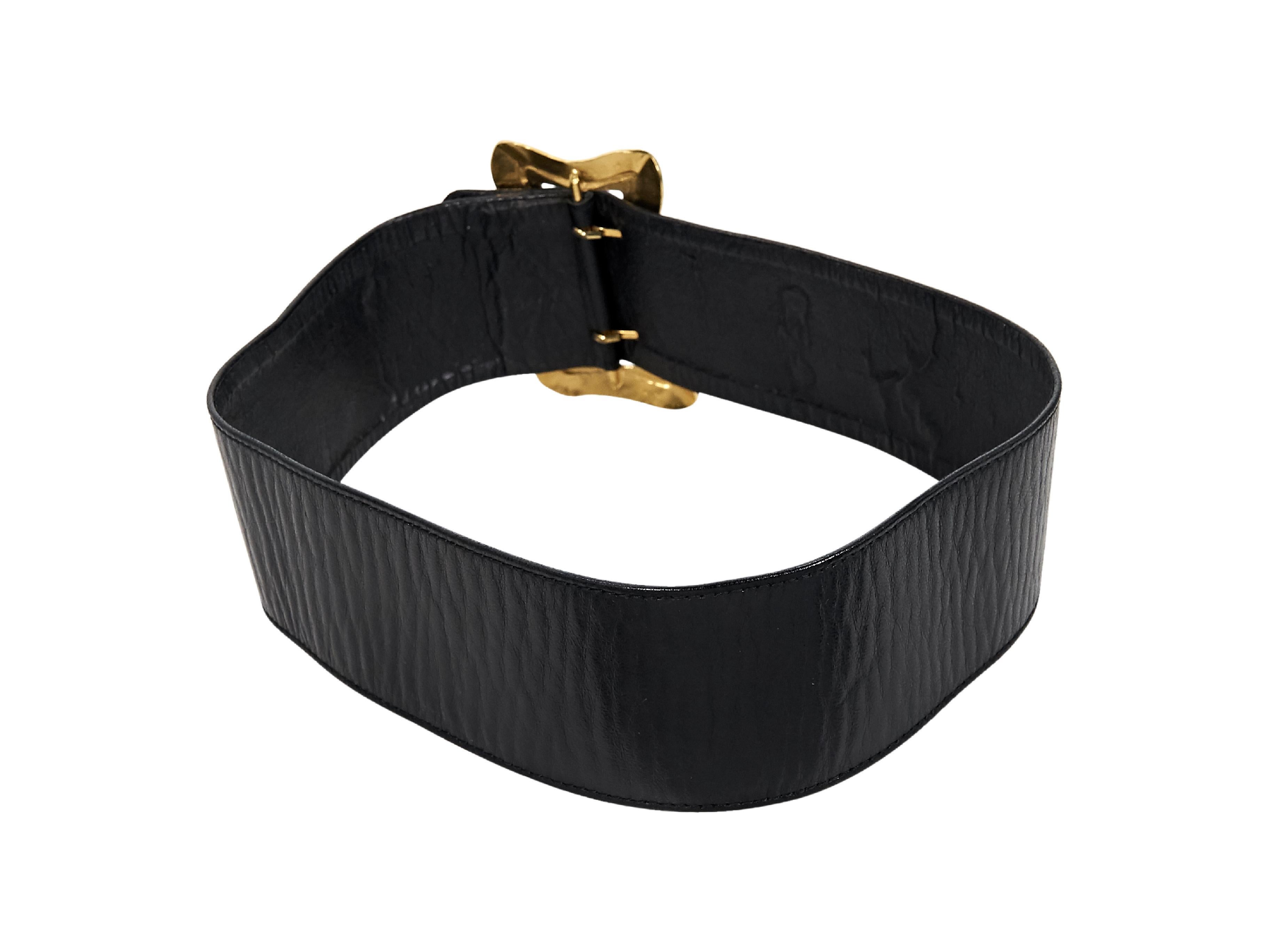 Product details:  Vintage black wide leather belt by Chanel.  Accented with butterfly details.  Adjustable buckle closure.  Goldtone hardware.  27