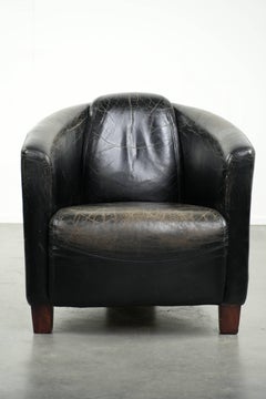 Black vintage cowhide aviator design armchair with characterful appearance