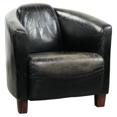 Black vintage cowhide aviator design armchair with characterful appearance