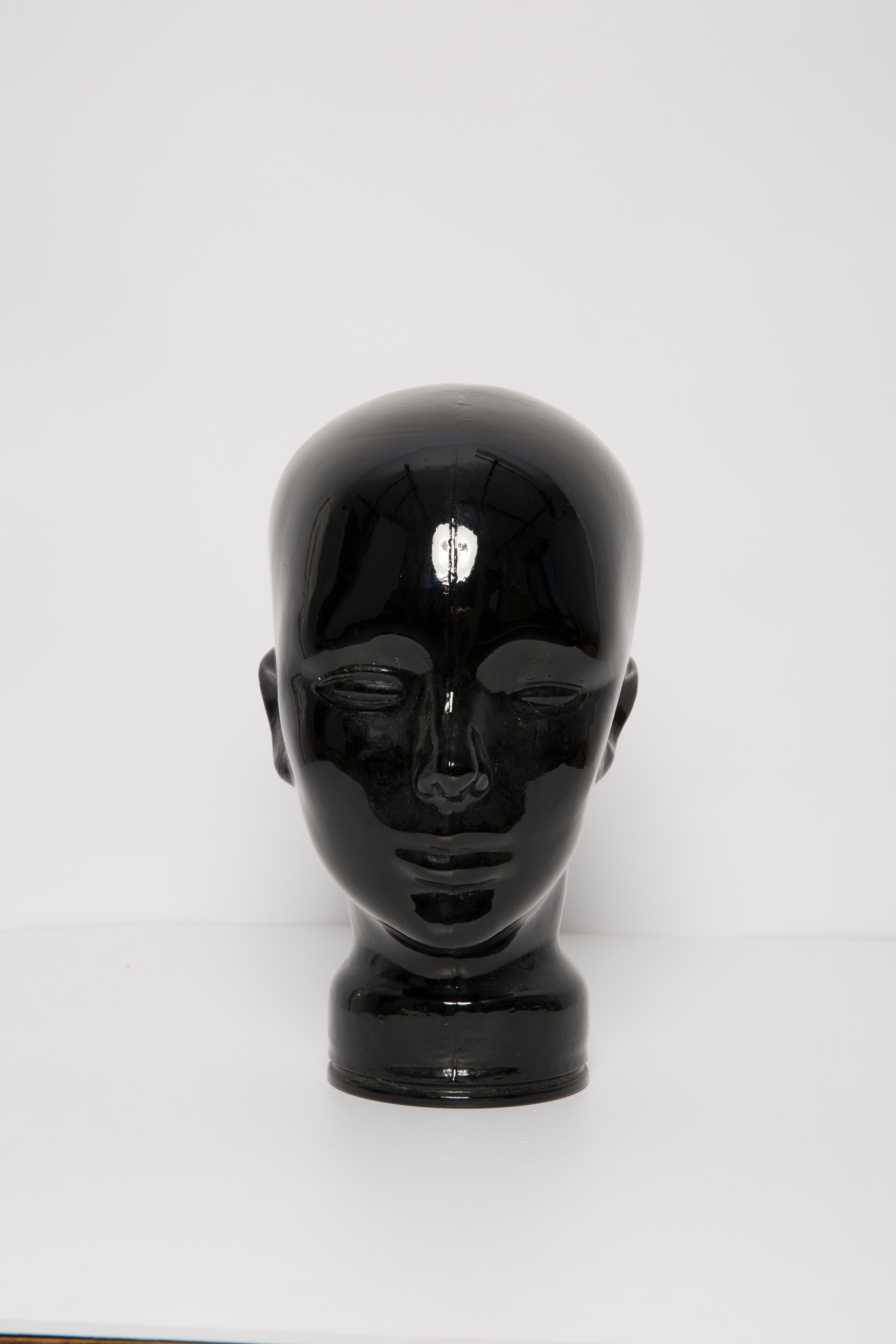 Life-size glass head in a deep black beautiful color. Produced in a German glassworks in the 1970s. Perfect condition. A perfect addition to the interior, photo prop, display or headphone stand.