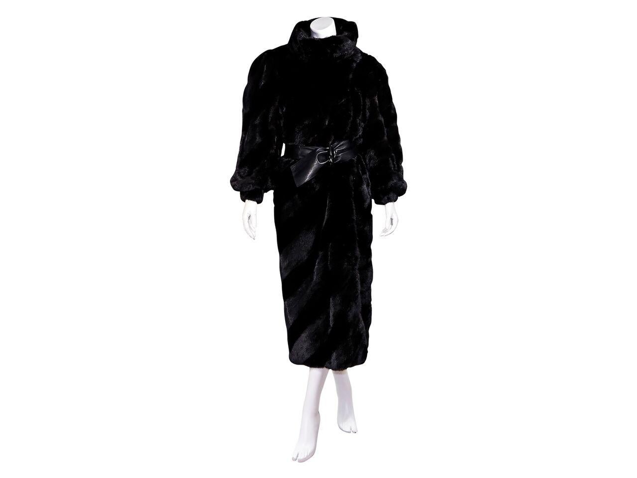 Product details:  Vintage black mink fur long coat by Fendi.  Exaggerated spread collar.  Long sleeves.  Concealed hook-front closure.  Leather belted waist.   33