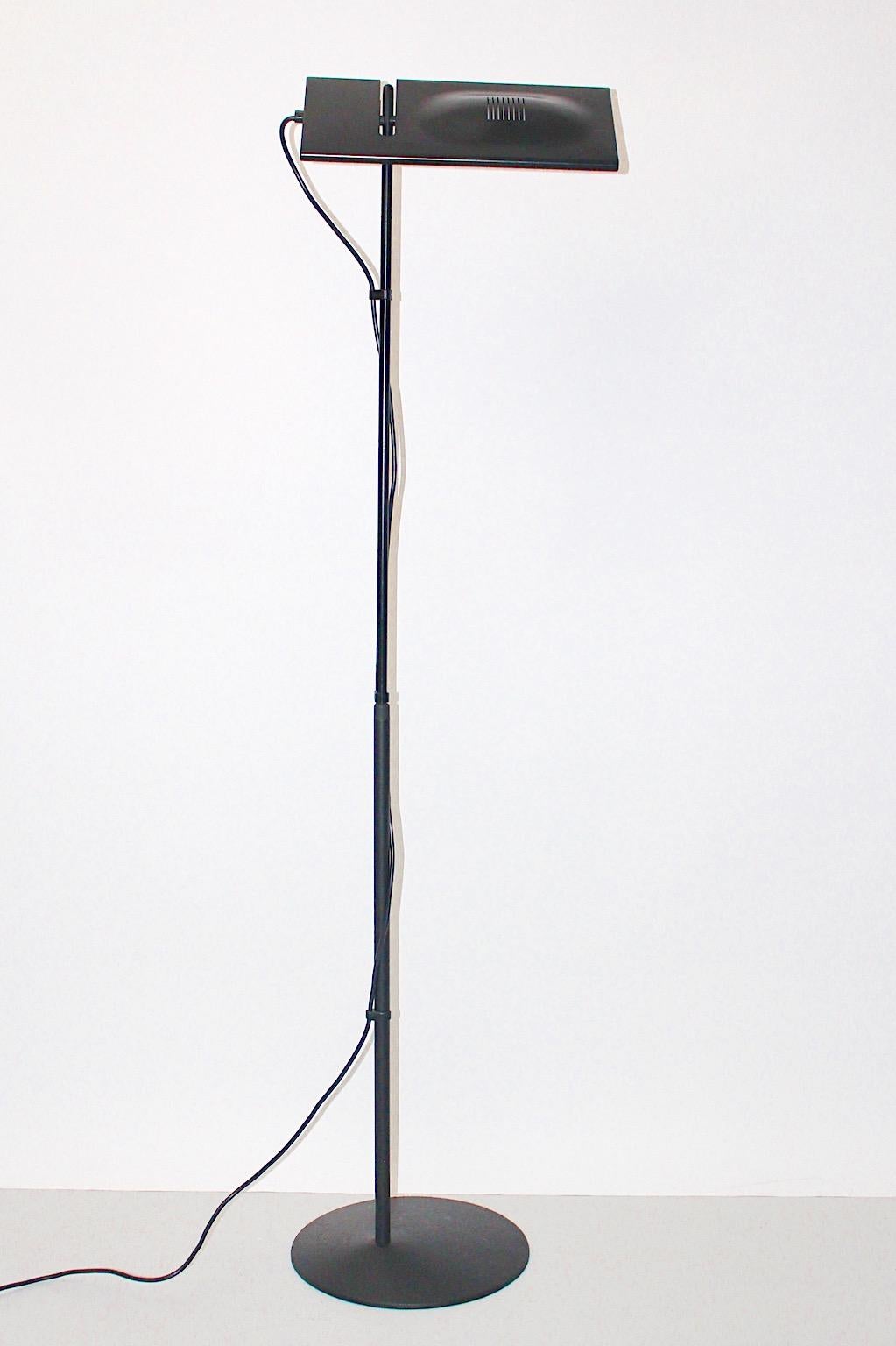 Black modern vintage floor lamp model Luna, which was designed by Marco Colombo & Mario Baraglia for PAF Studio Milano, circa 1980.
The floor lamp shows black lacquered adjustable metal stem and adjustable lamp shade.
It lights with a halogen lamp