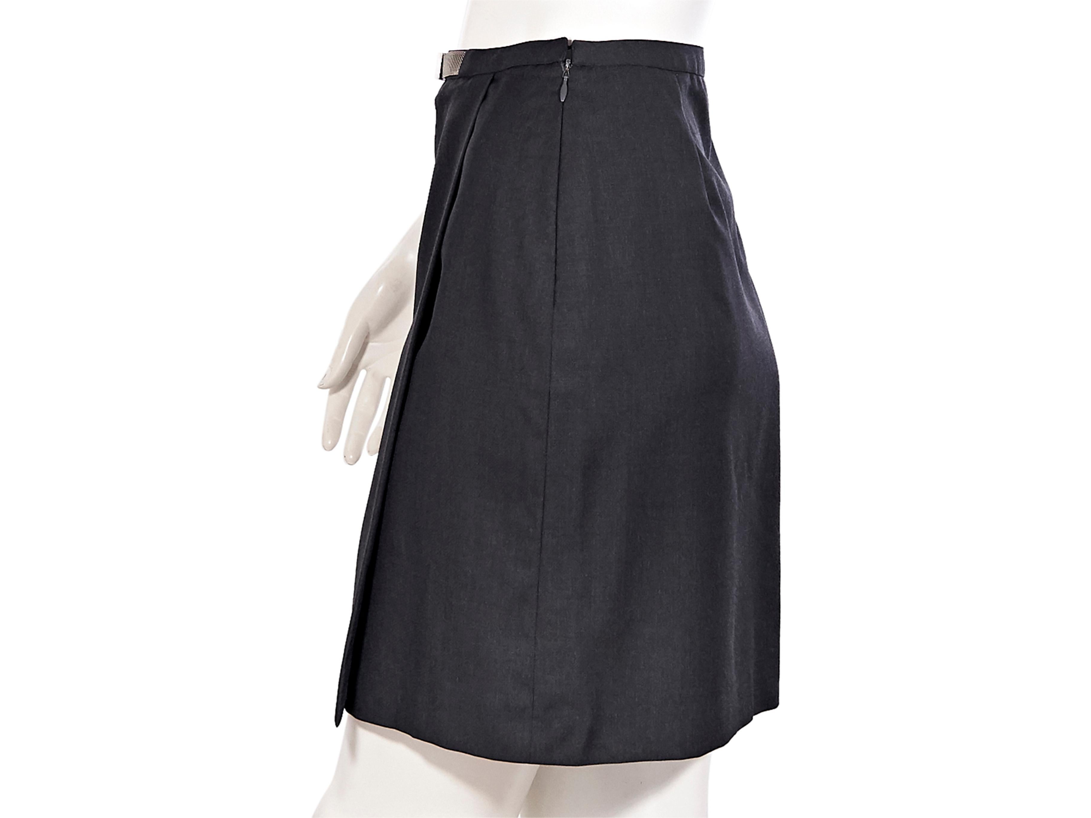 Product details: Vintage black wool mini skirt by Gianni Versace Couture. Logo-embossed silver-tone mesh-accented belt at front. Concealed side zip closure. Pair with black Mary-Jane pumps. Label size IT 40. 29