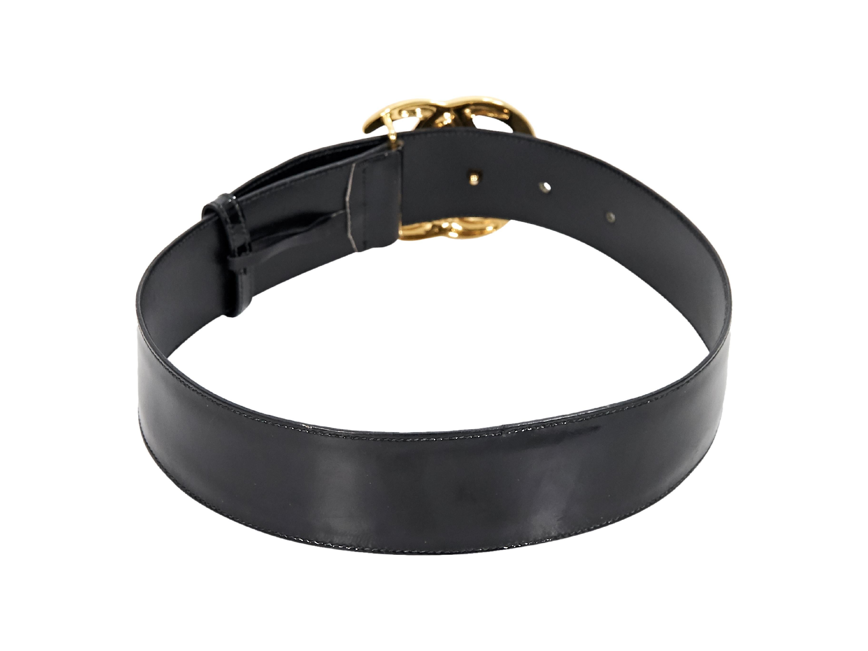 Product details:  Vintage black patent leather belt by Gucci.  Adjustable logo pin buckle closure.  Goldtone hardware.  28-30