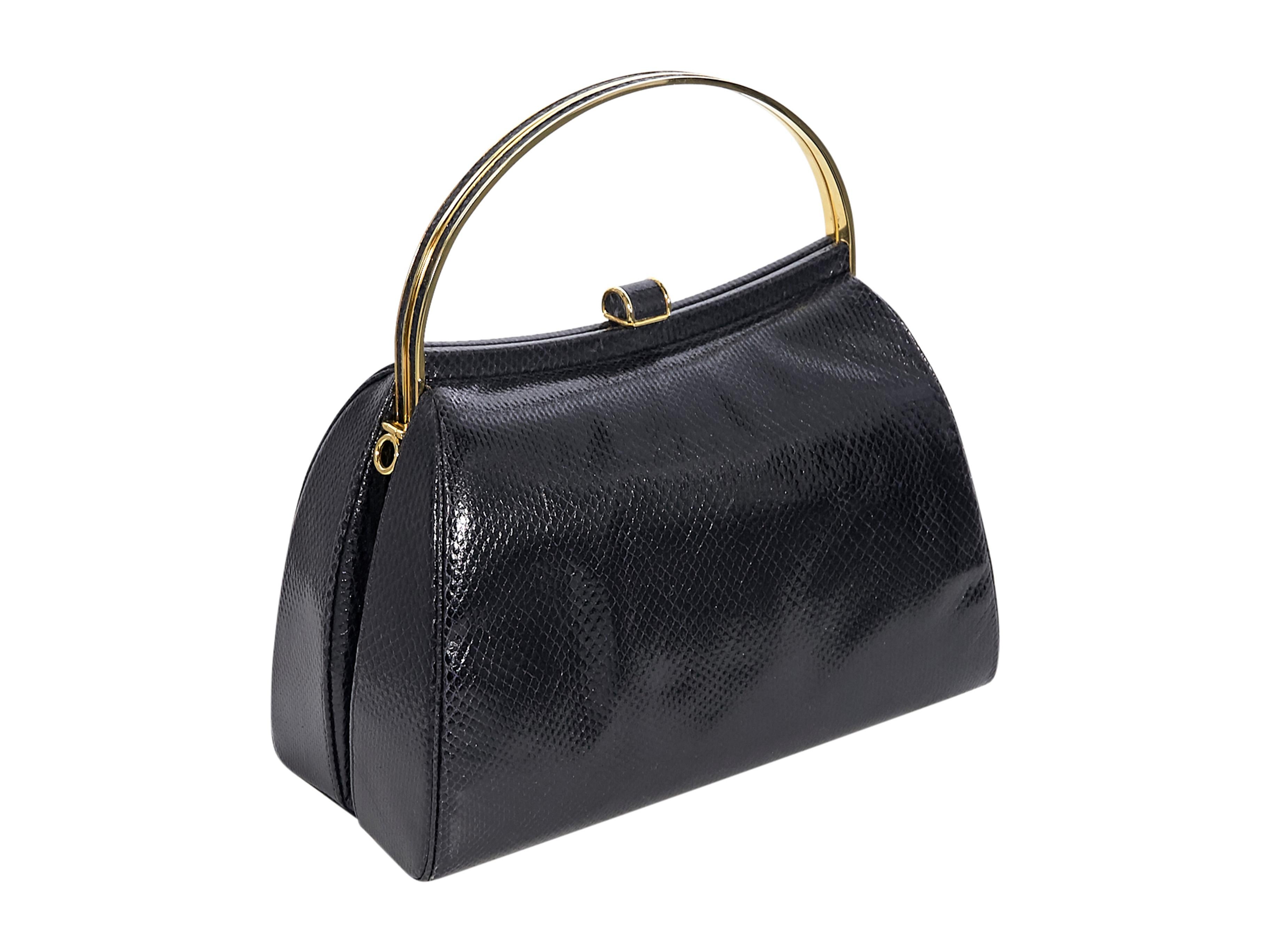 Product details:  Vintage black leather snakeskin-embossed handbag by Judith Leiber.  Gold-tone top handles. Snap top closure. Lined interior with inner slip pocket.  Protective metal feet. Gold-tone hardware. Style with a sleeveless cotton-poplin