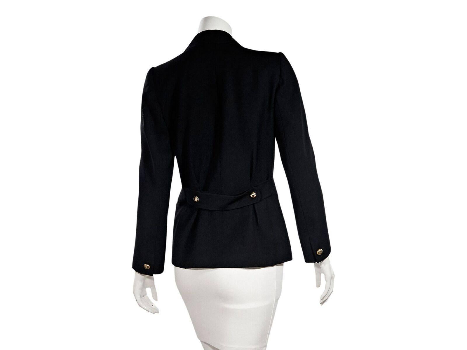 Product details:  Vintage black blazer by Yves Saint Laurent.  Notched lapel.  Long sleeves.  Single button cuffs.  Double-breasted button-front closure.  Besom chest and waist pockets.  Label size FR 36.  36