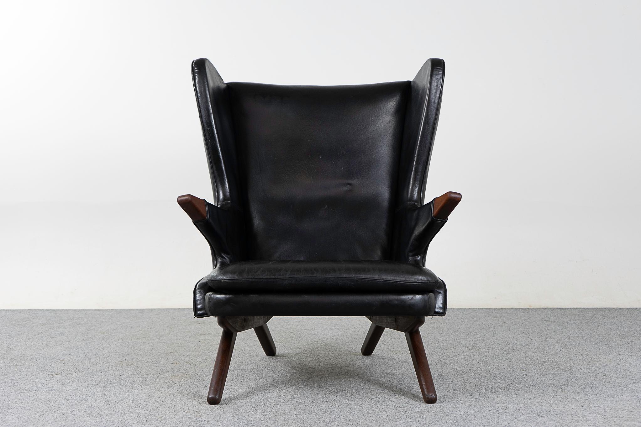 Teak & black vinyl Model 91 chair lounge chair by Svend Skipper, circa 1960's. Iconic eye catching design, as comfortable as it is stylish! Winged high back provides excellent support for your neck. Original upholstery with a fair amount of
