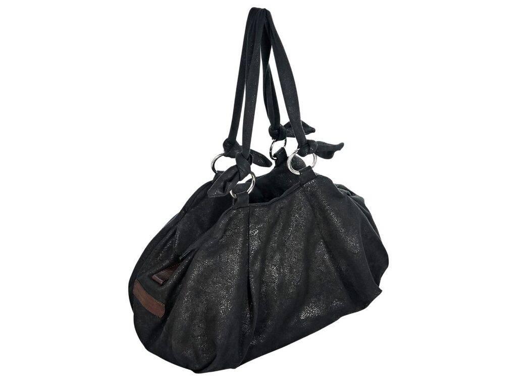 Product details:  Black leather shoulder bag by Vivienne Westwood.  Dual shoulder straps.  Top zip closure.  Lined interior with inner slide pockets.  Protective metal feet.  Silvertone hardware.  19
