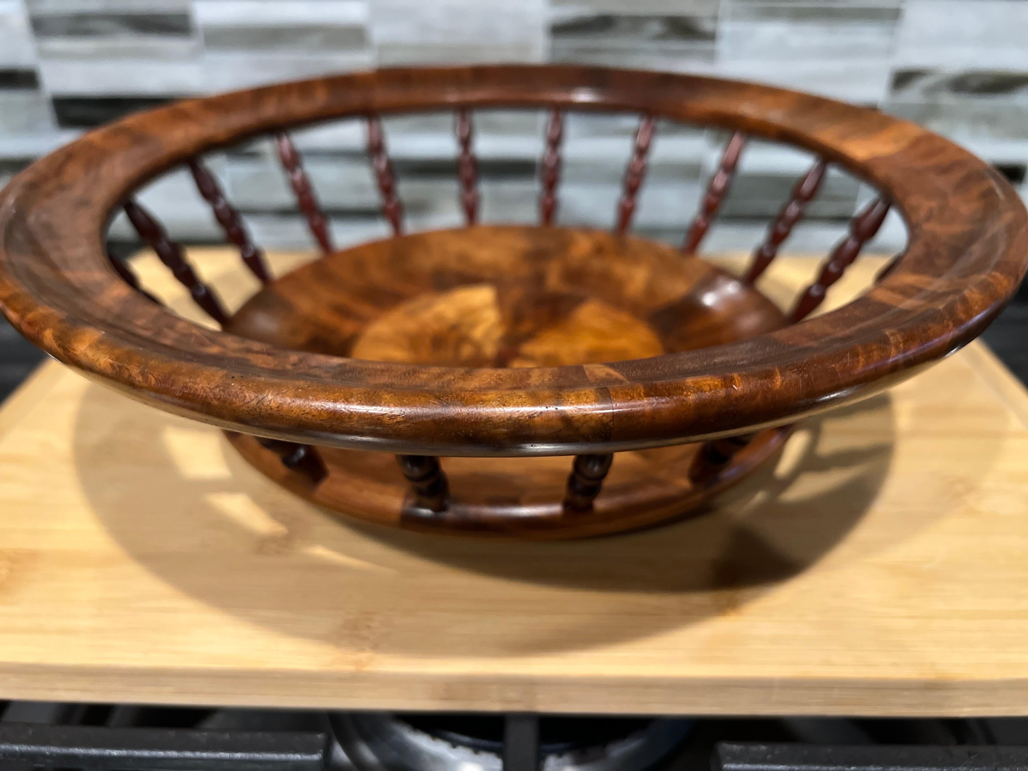 American, circa 2000.

A hand turned studio crafted bowl. Made of Blood Wood & Black Walnut - Signed to the underside. 