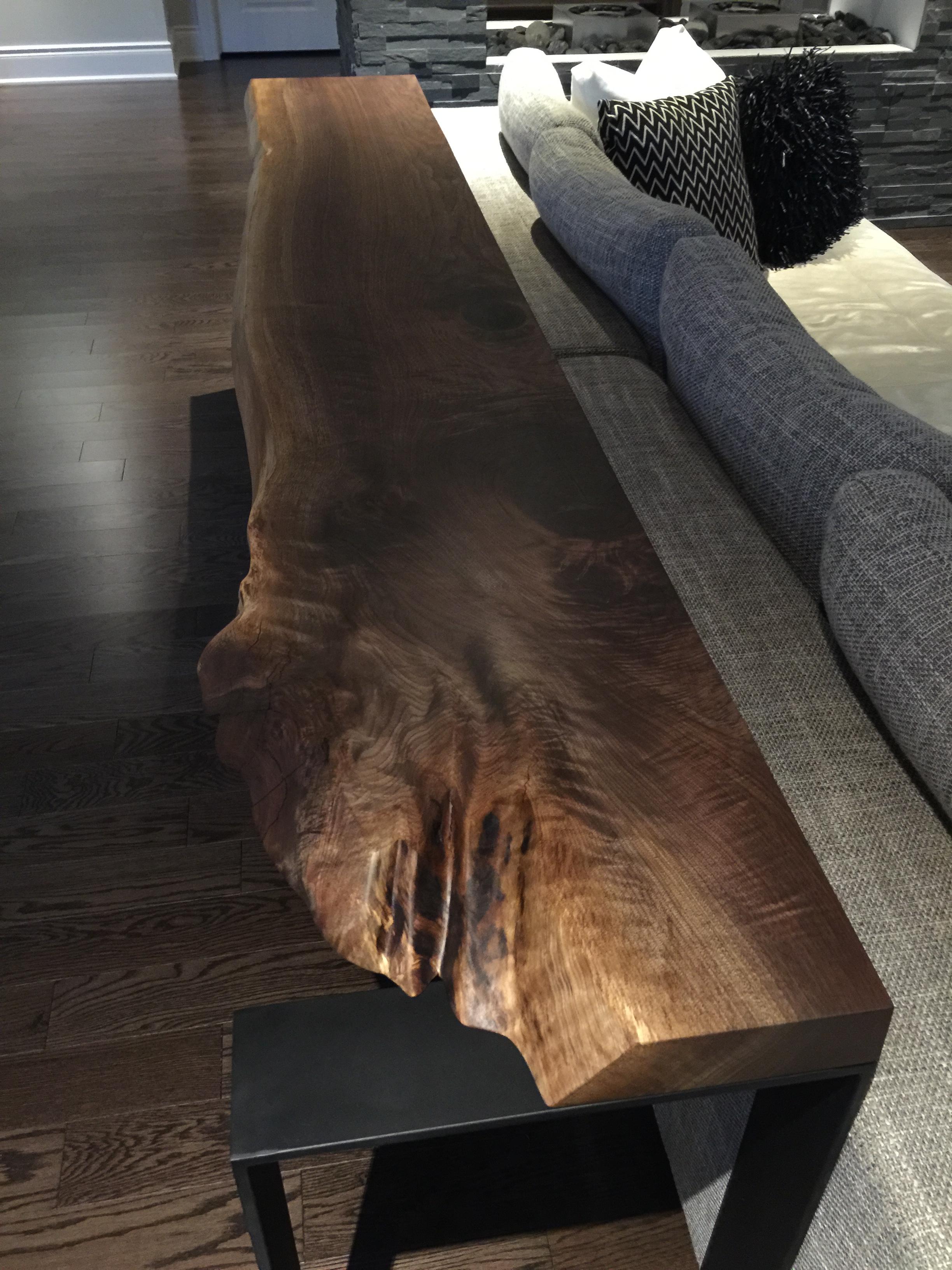 Black walnut console live edge on U-shape steel legs can fit anywhere in your house. The beauty with this console is that we use the mis shape of the live edge and the steel having the same dimensions legs so the steel shows. Also, it is a very