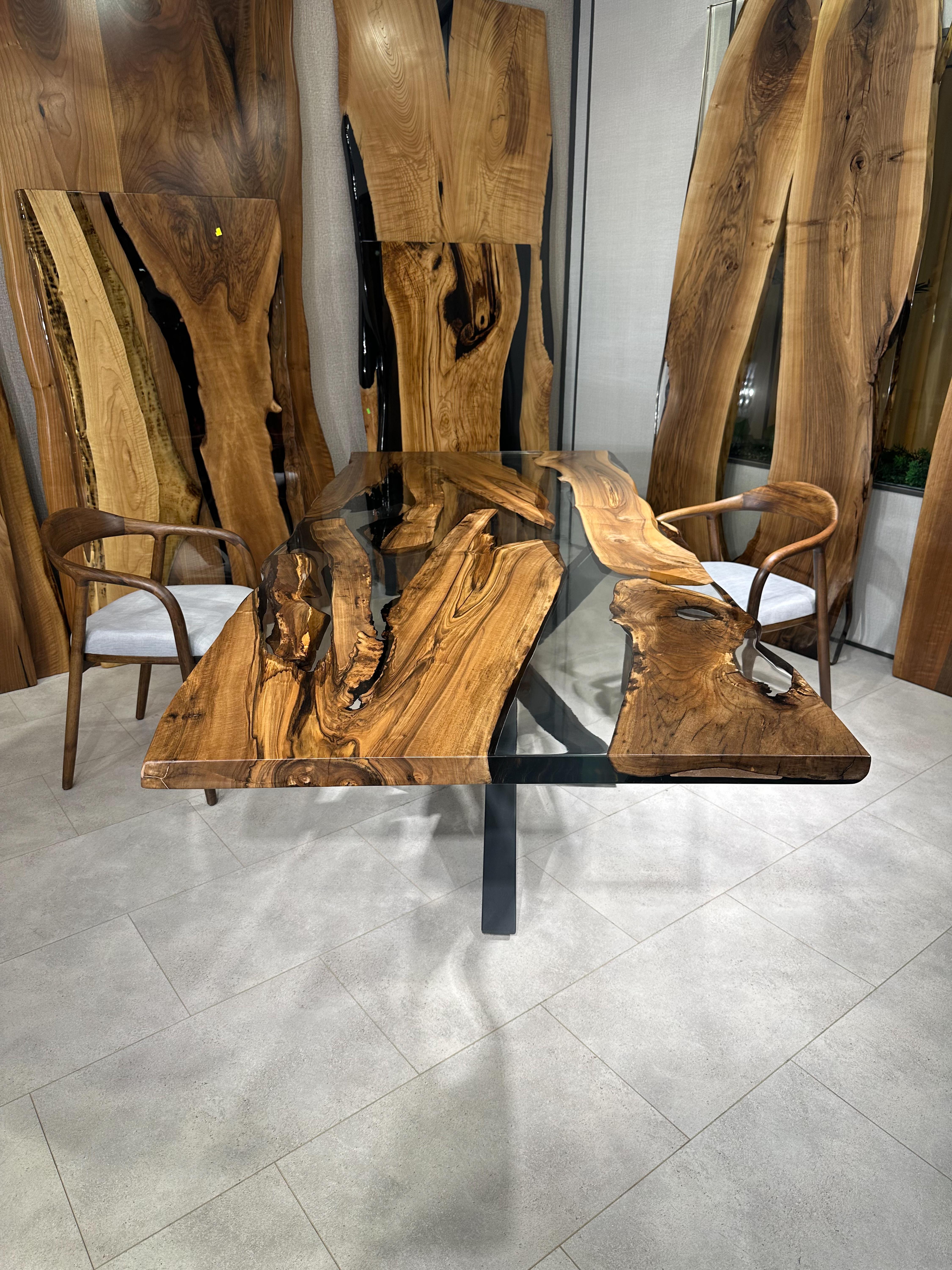 Walnut Live Edge Custom Clear Epoxy Resin Round Dining Table 

This table is made of 500 years old walnut wood. The grains and texture of the wood describe what a natural walnut woods looks like.
It can be used as a dining table or as a conference