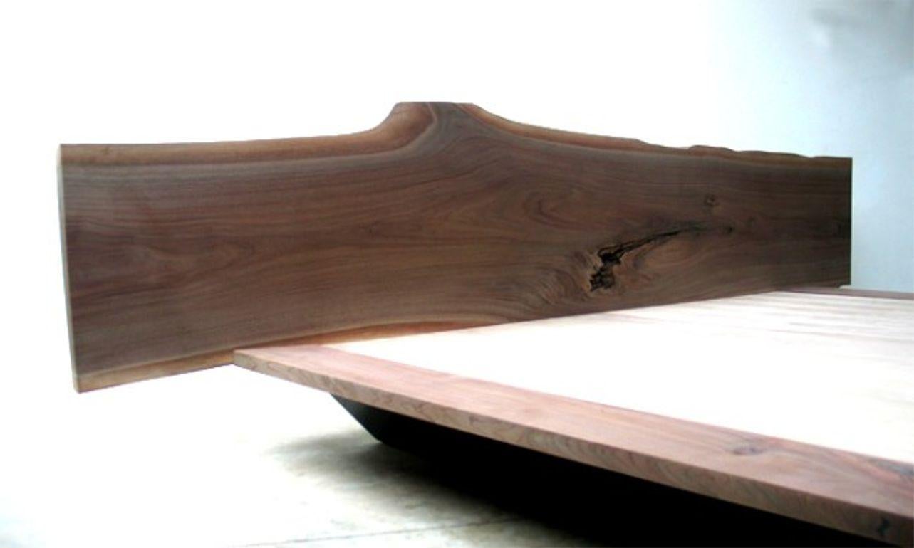 Black walnut milled headboard and angled bed frame
Dimensions may vary.