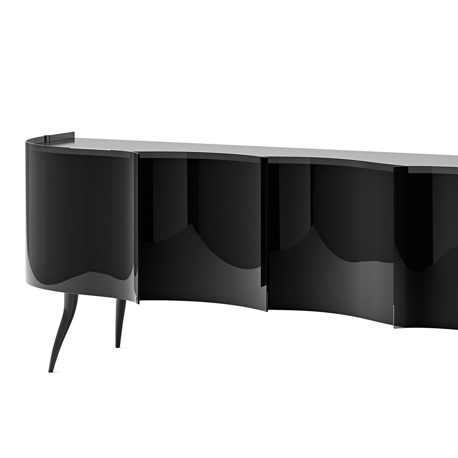 Sideboard black waves with structure in solid wood
in glossy finish. Doors and front parts in smoked tempered
glass and frames in blackened painted metal.