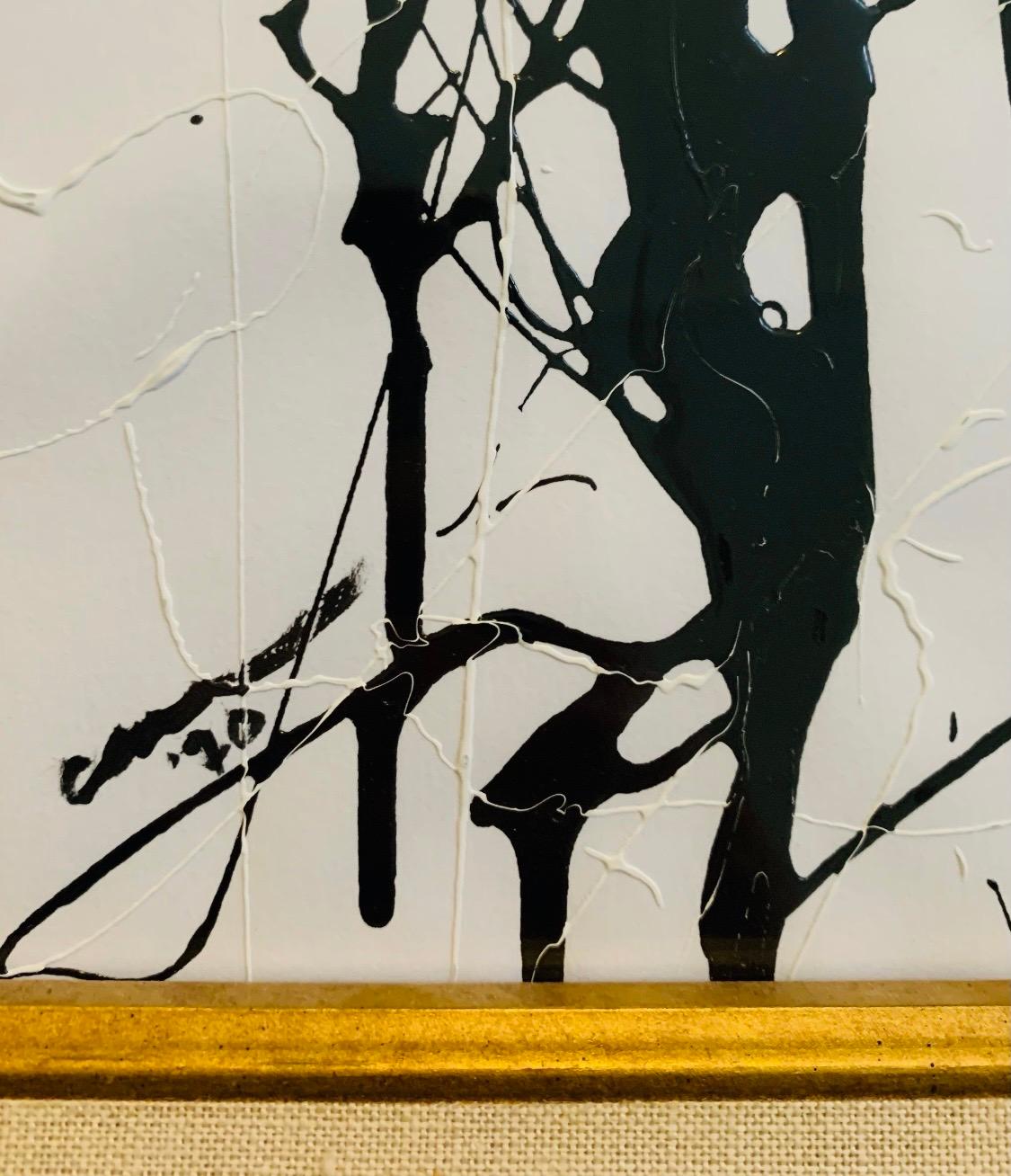 An abstract Expressionist painting utilizing black and white acrylic enamel paint in a gestural manner creating a dynamic downward movement of the paint. Signed lower left Carri, 1970 and displayed under glass in a newer gold giltwood frame.