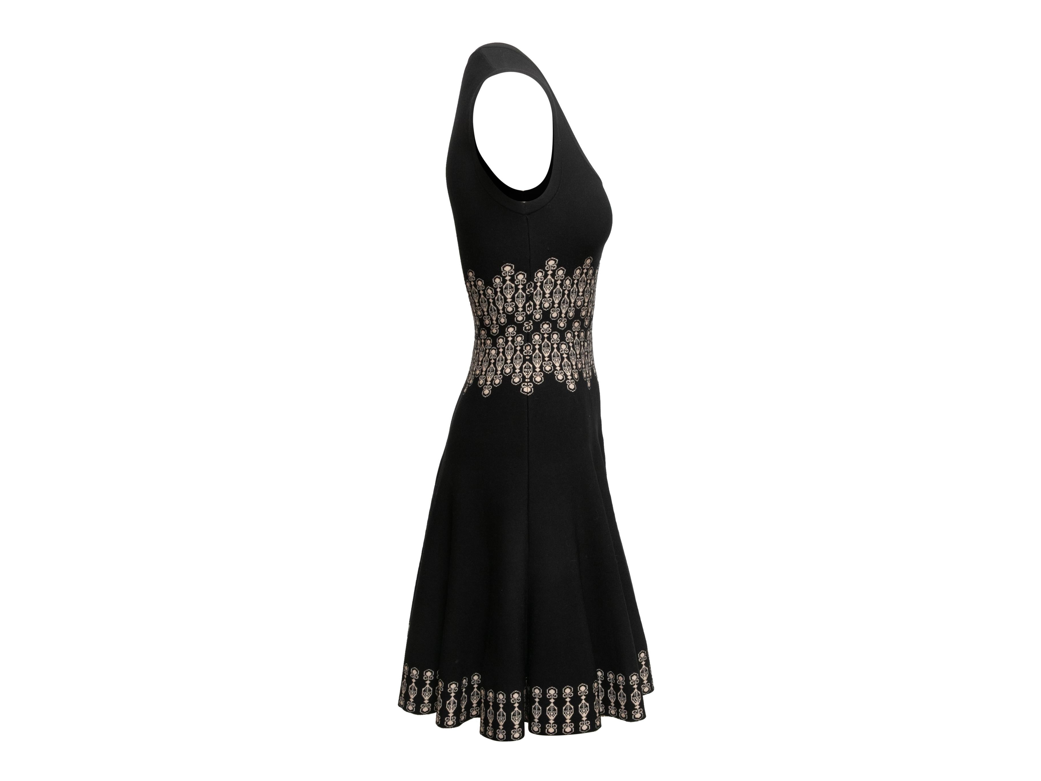 Black and white sleeveless fit and flare dress by Alaia. Scoop neckline. Print at waist and hem. 28