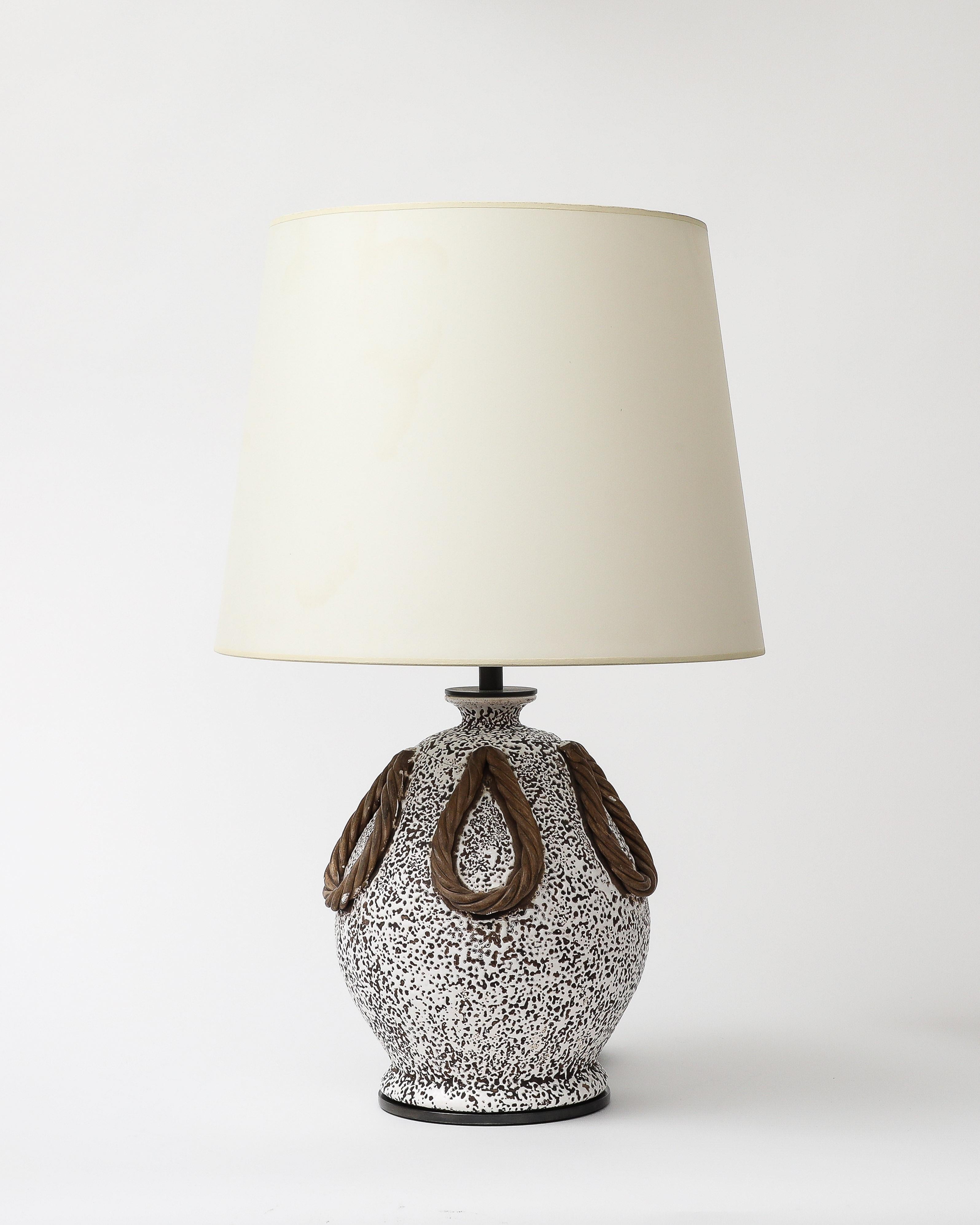 Glazed ceramic table lamp in the manner of Jean Besnard. Produced at legendary French ceramic studio Keramos.

Newly rewired with a black twisted silk cord, dimmer at the neck, on/off on the cord, and 5