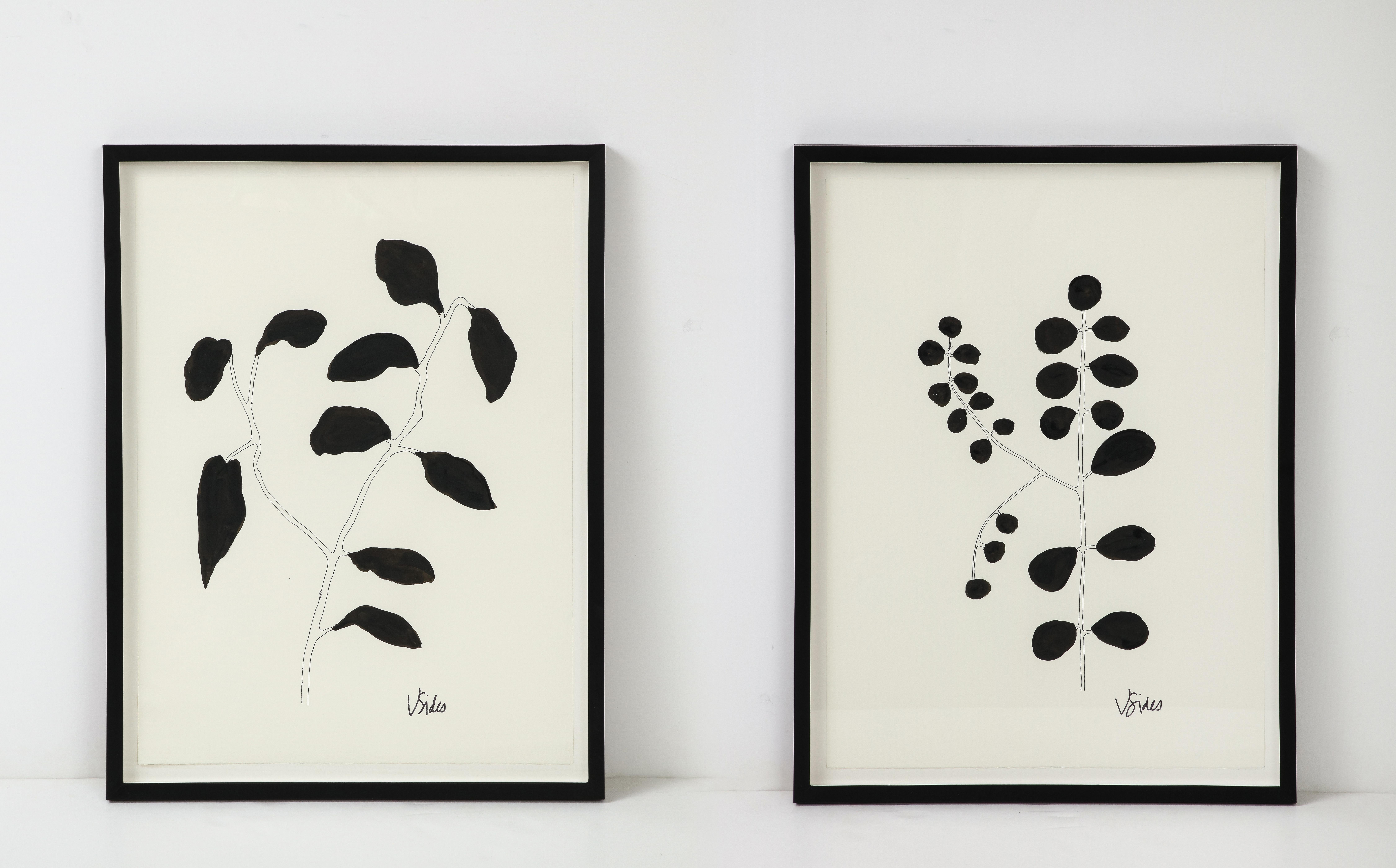 We love the graphic simplicity of these works of art. Created and signed by Georgia artist Victoria Sides, the works are stylized interpretation of leafy flowers. Each is different, but work well in a pair. Their neutral color allows them to go