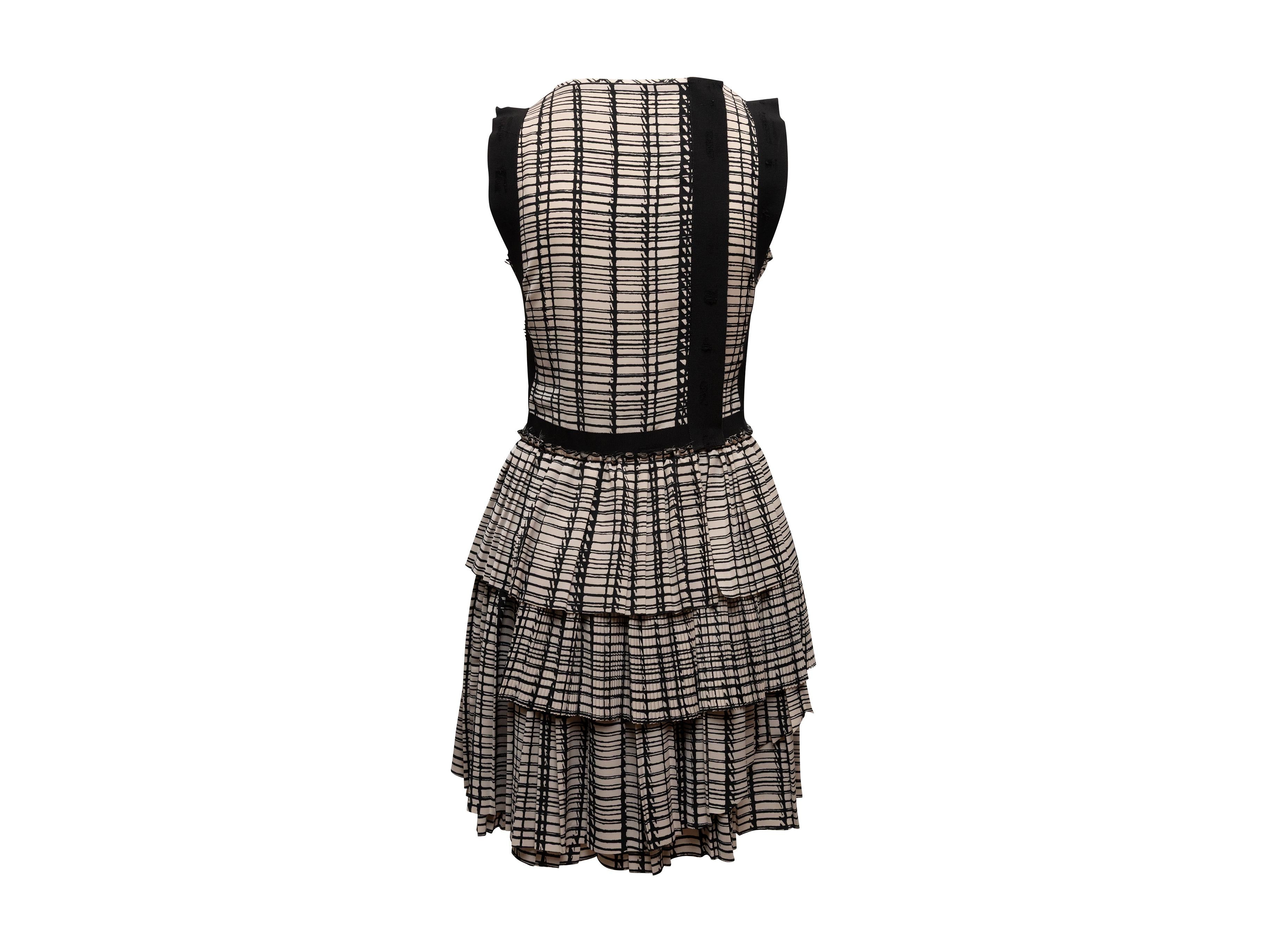 Black and white silk printed sleeveless dress by Bottega Veneta. Crew neck. Tiered pleating at skirt. Zip closure at back. 34