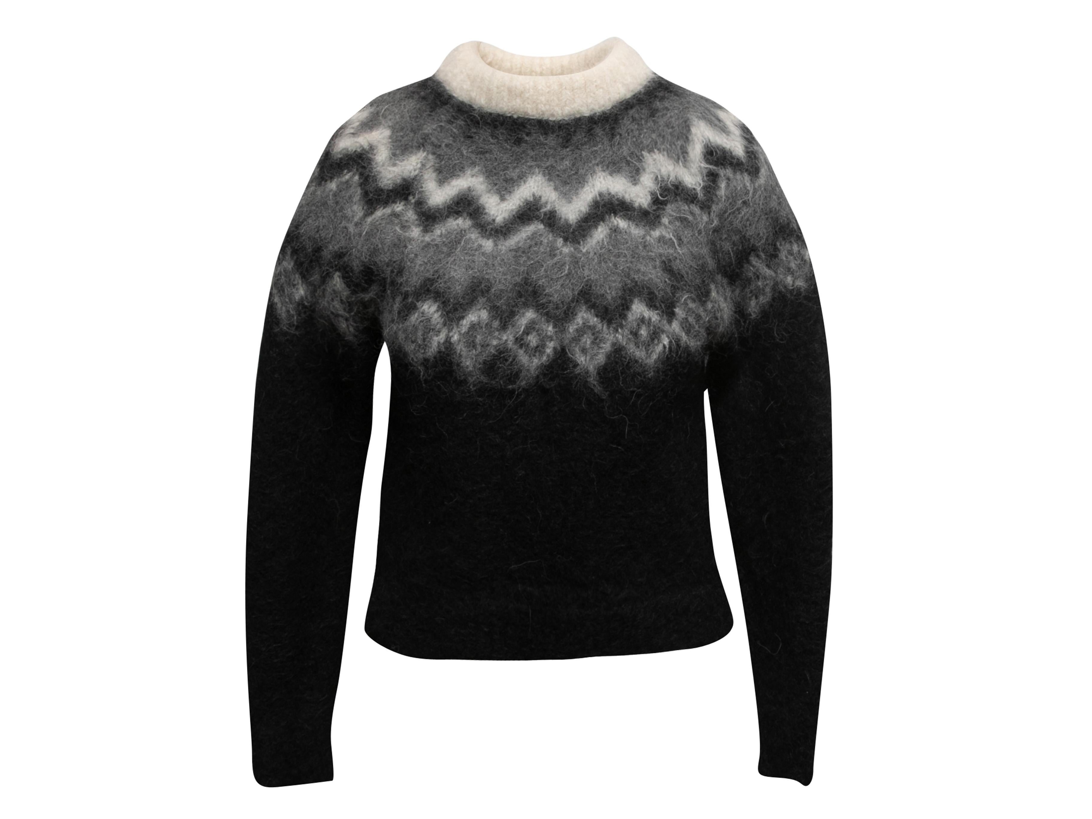 Pull Fair Isle noir et blanc en alpaga et laine, signé Celine. Col ras du cou. Manches longues. Poitrine de 32