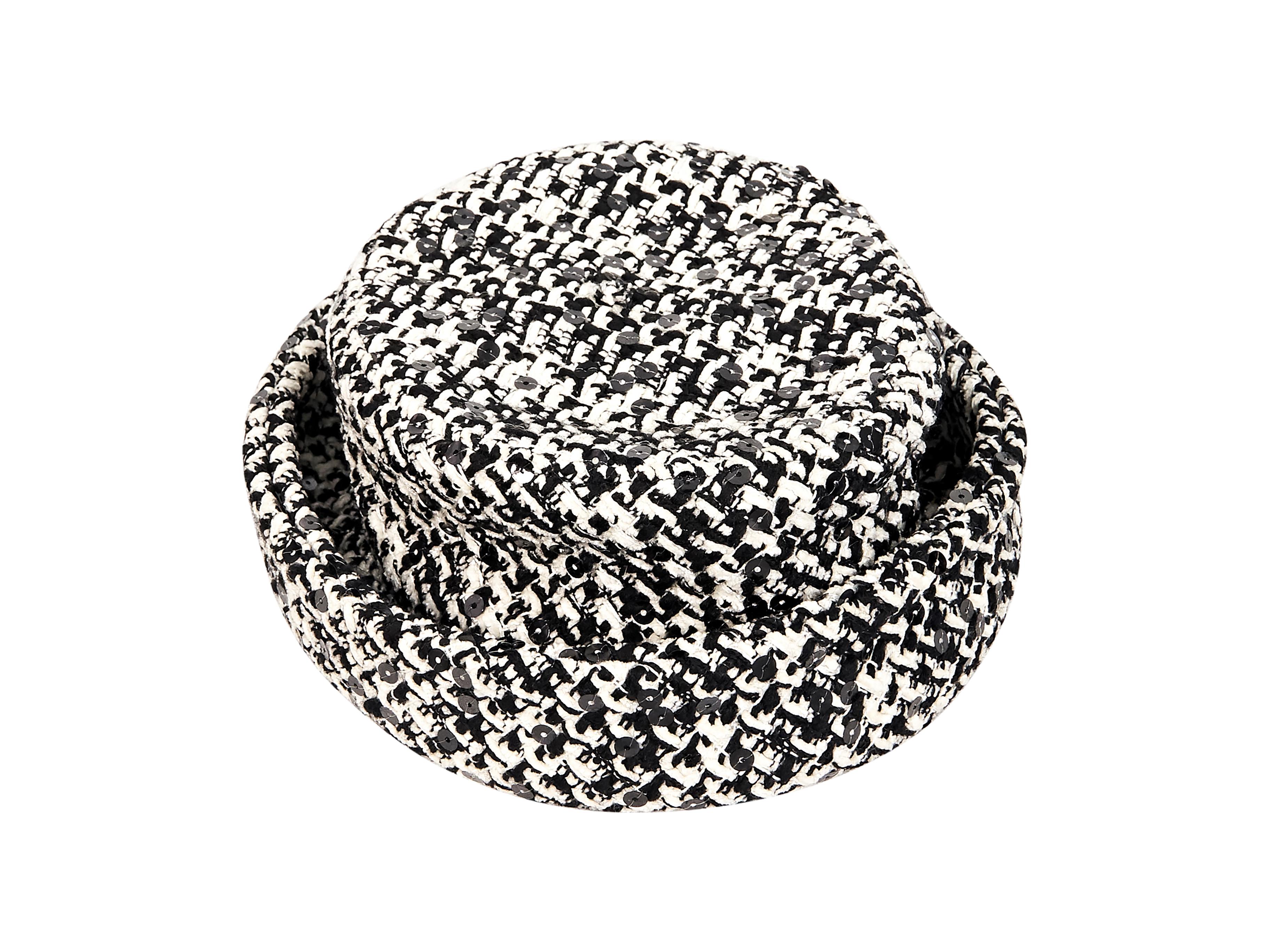 Product details:  Black and white boucle hat by Chanel.  Accented with sequins.  Inner grosgrain sweatband.  23.5