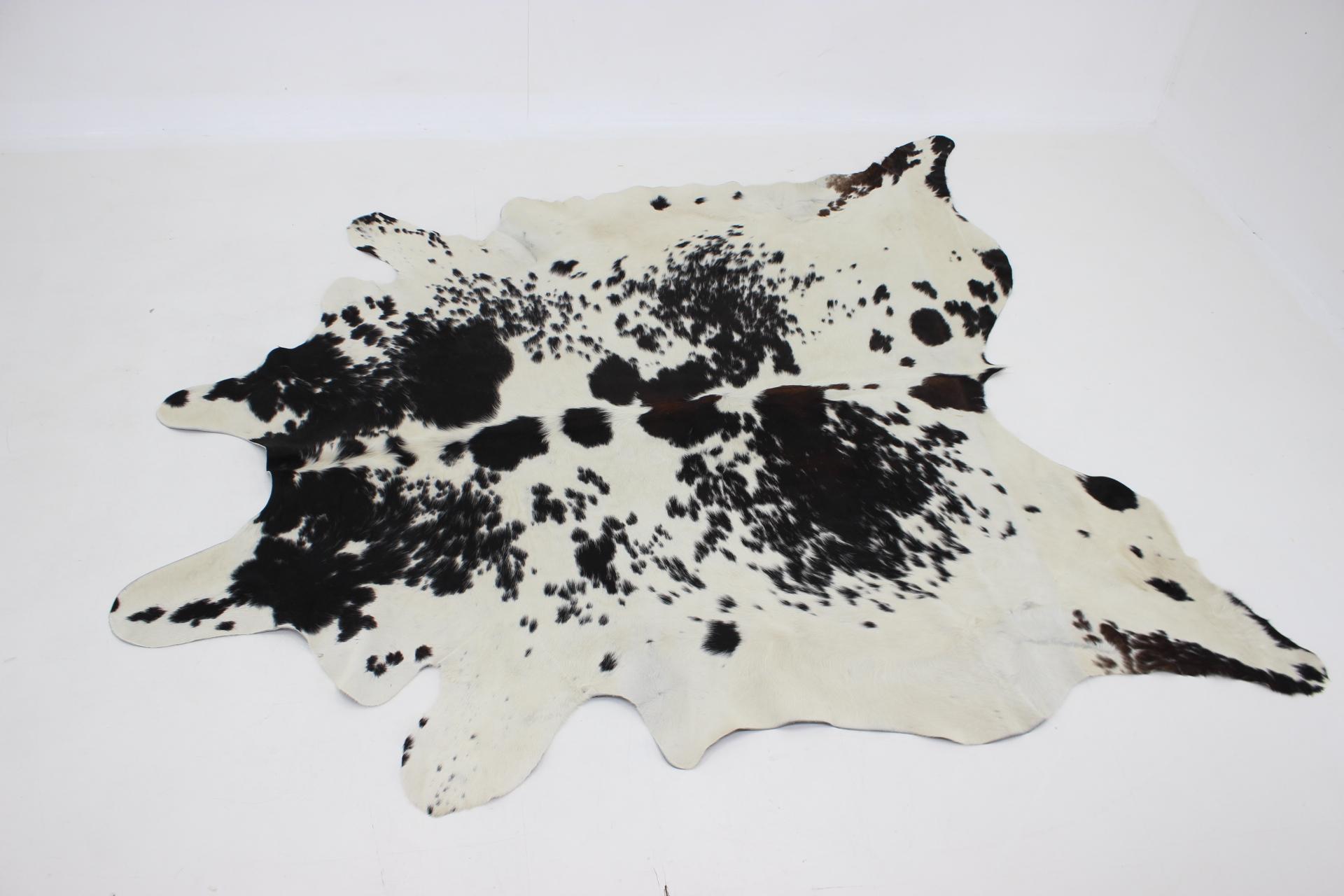 Black and white cowhide rug in very good condition.