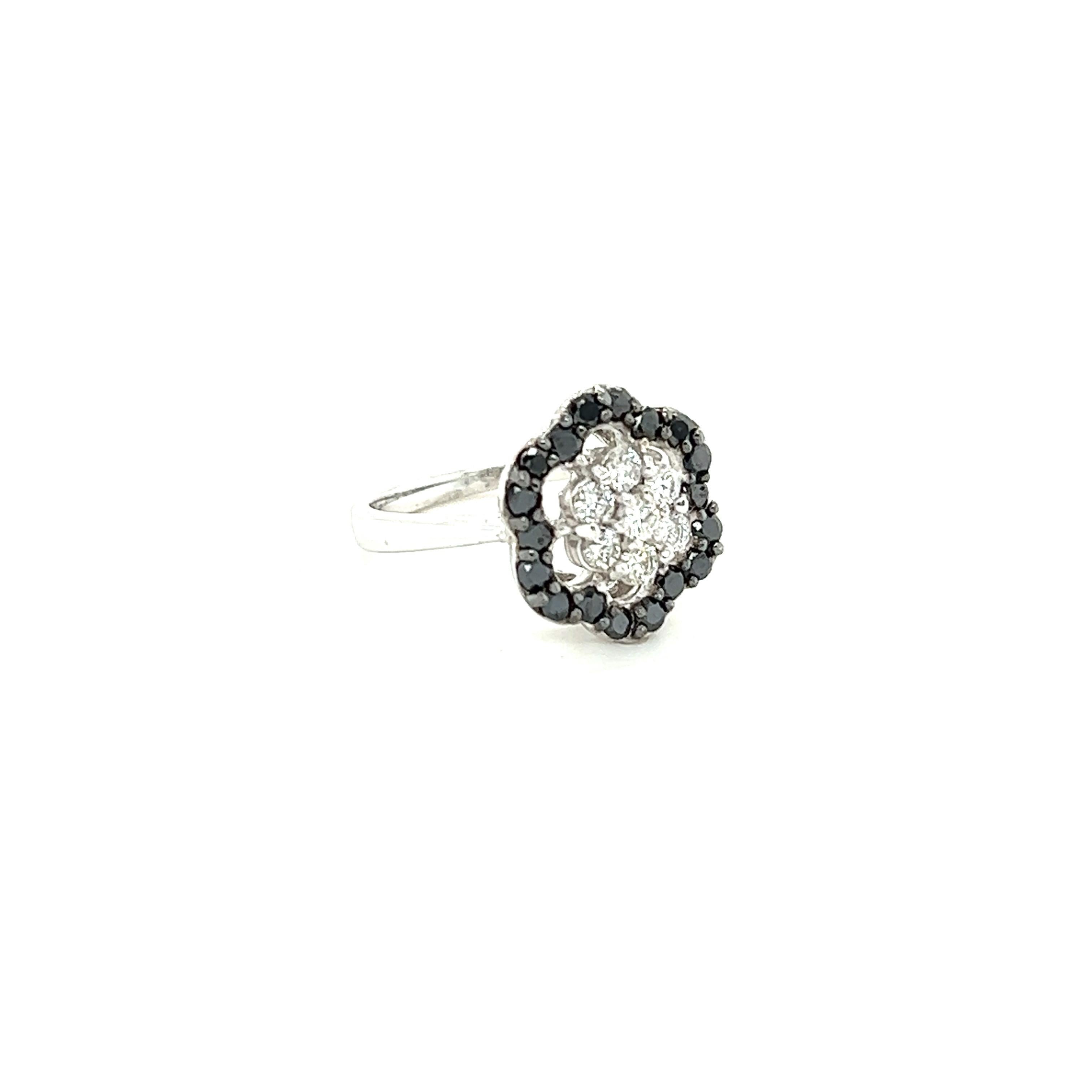 This ring has 18 Black Round Cut Natural Diamonds that weigh 0.62 carats and 7 Round Cut Natural Diamonds that weigh 0.37 carats. The clarity and color are SI-F. The total carat weight of the ring is 0.99 carats. 

Curated in 14 Karat White Gold and