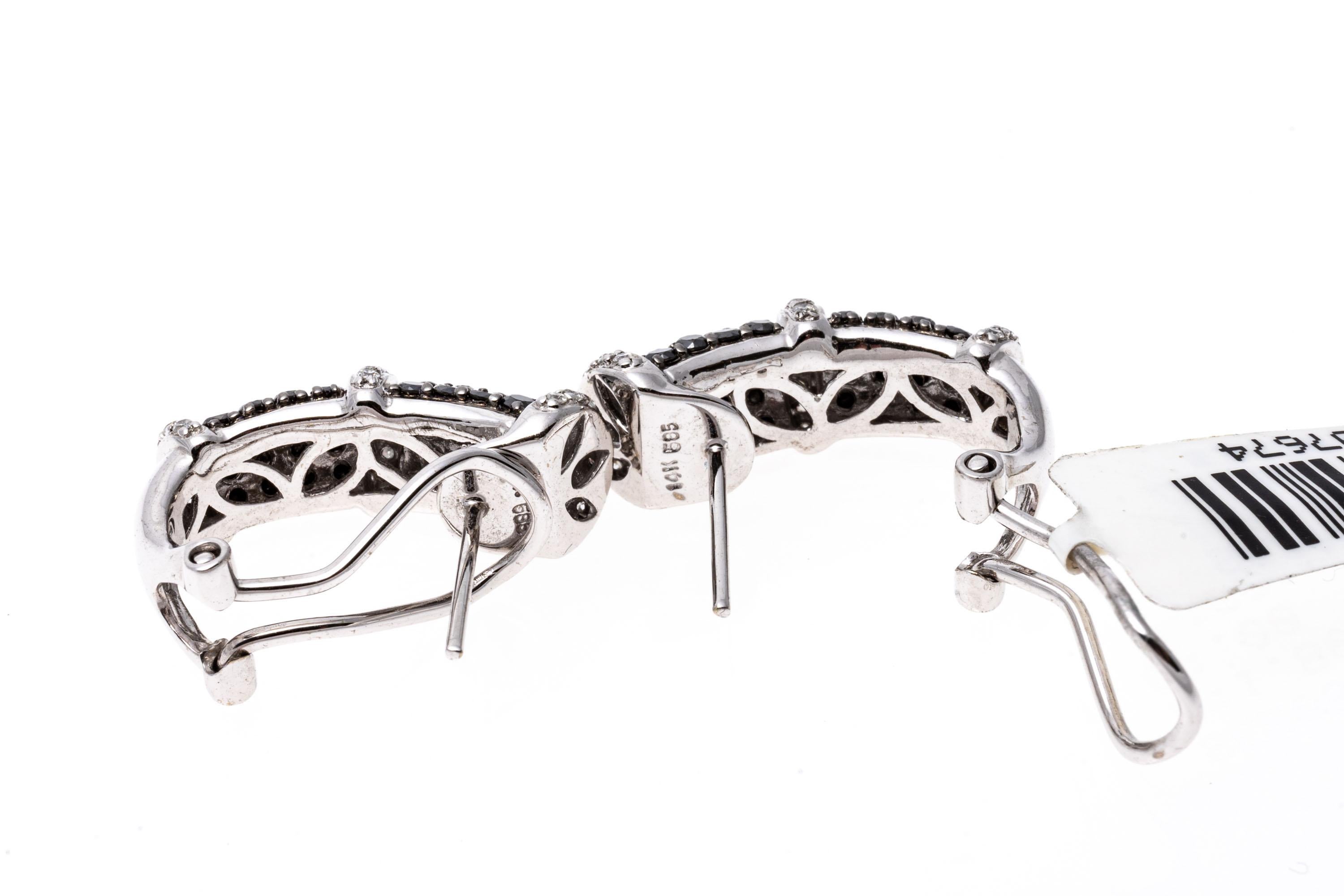 Black & White Diamond J Hoop Earrings Set in 14K White Gold
Make a truly elegant statement with these J-hoop style earrings. Adorned with contrasting black and white diamonds and crafted of 14K white gold these earring will make a special addition