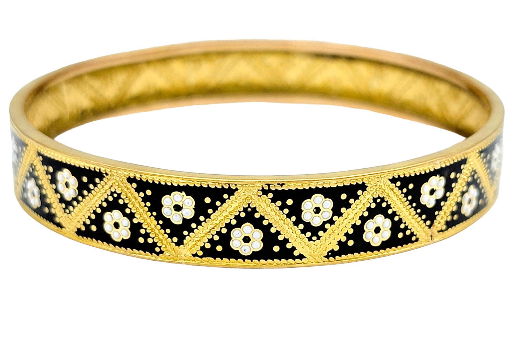 Elevate your wrist with the timeless allure of this exquisite bangle bracelet, crafted in luxurious 22 karat yellow gold. Its sleek and sophisticated design is accentuated by a delicate milgrain edging, adding a touch of vintage-inspired charm to