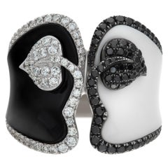 Black & white enamel ring in white gold. Wrapped with (0.50ct) matching diamonds