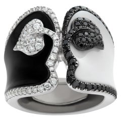 Black & white enamel ring in white gold. Wrapped with (0.50ct) matching diamonds