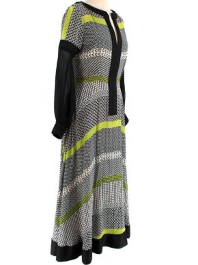Amanda Wakeley black, white & green geometric print silk dress
 
 - Repeating geometric print with vibrant green accents
 - Notched neck with black trim
 - Cinched waistline 
 - Flared midi skirt
 - Semi-sheer sleeve with dropped shoulder
 - Zip