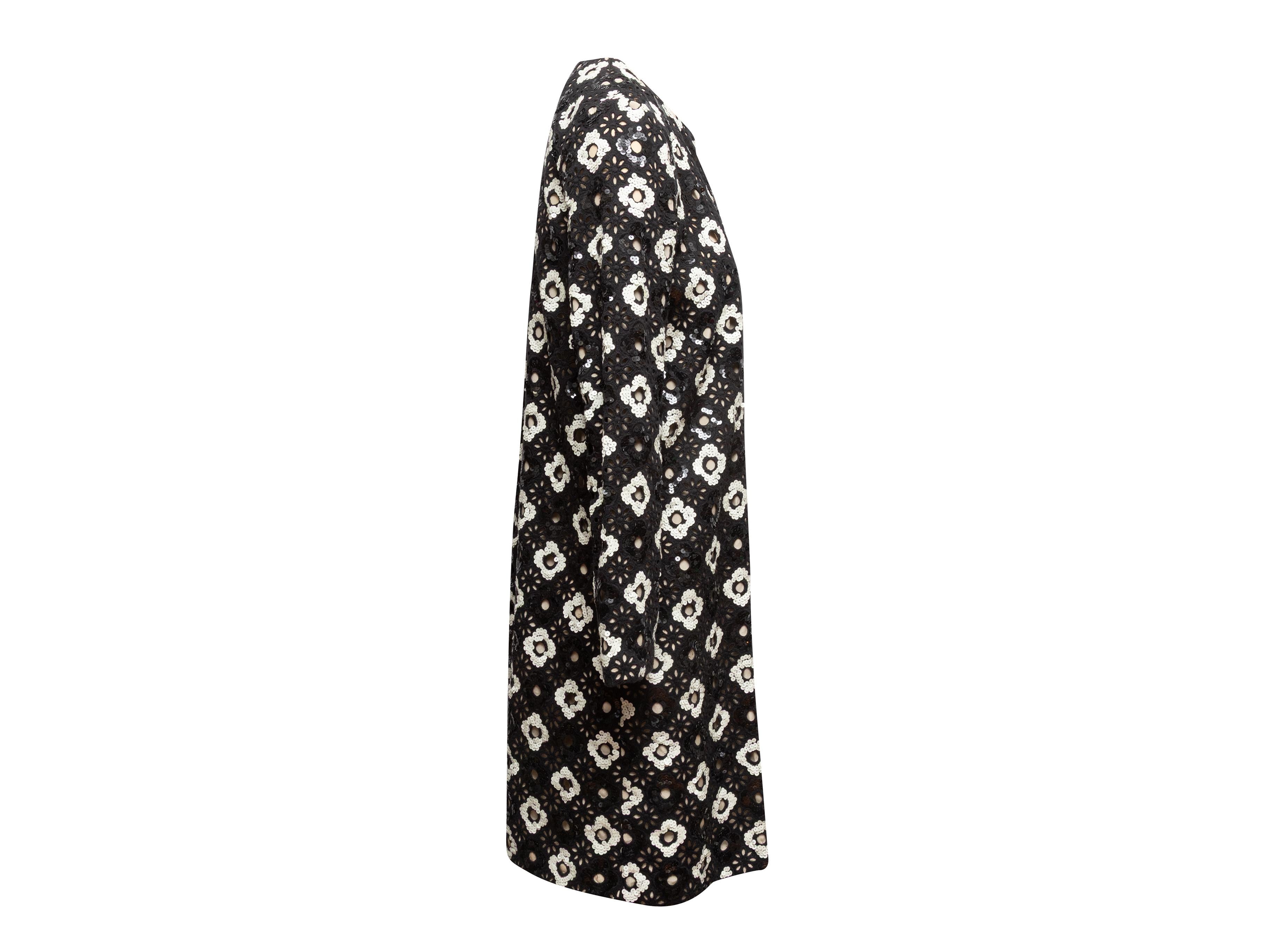 Black and white guipure lace coat by Huishan Zhang. Sequin embellishments throughout. Crew neck. Silk lining. 36