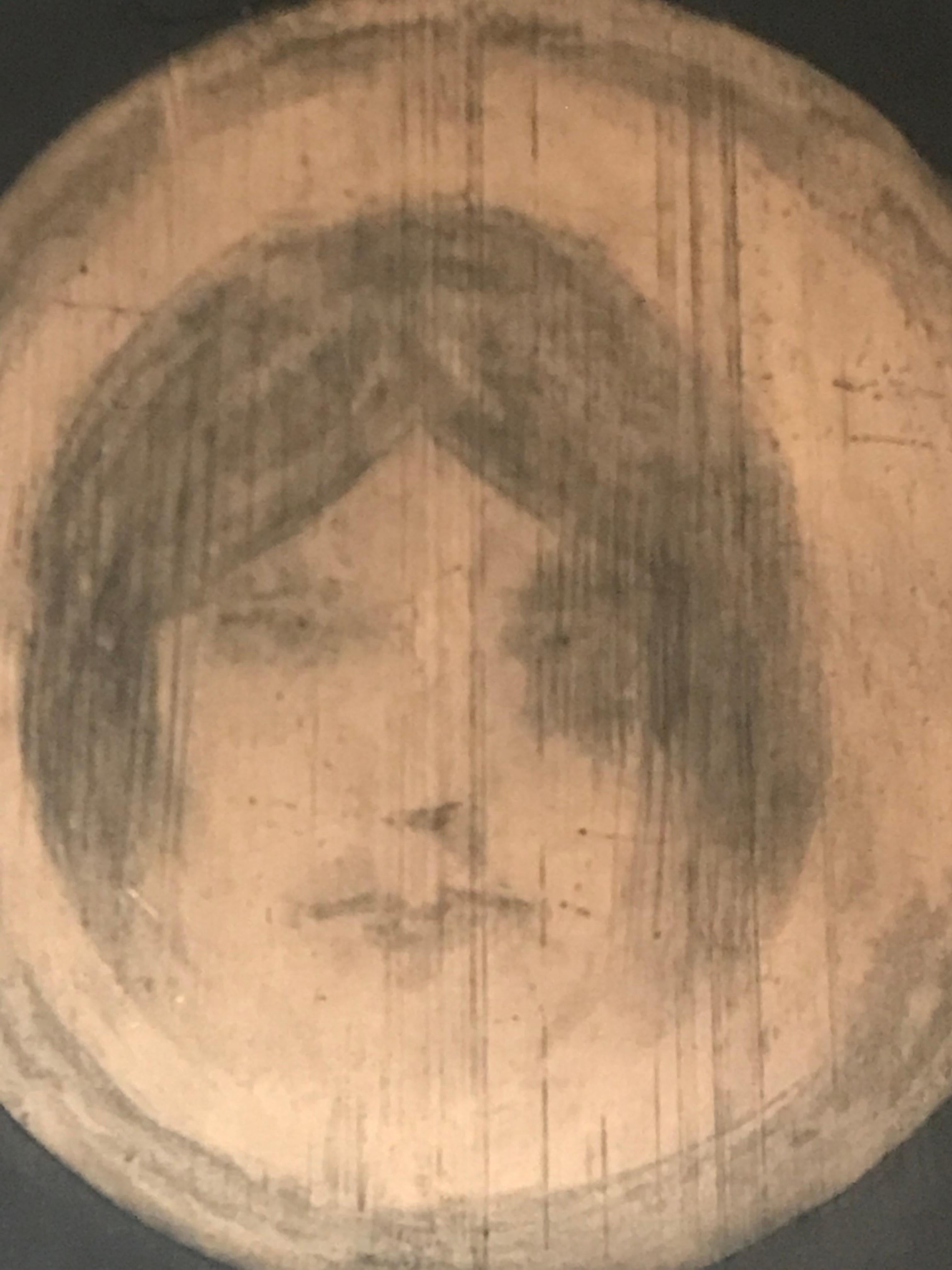 Enigmatic lithograph depicting the face of a woman.
This artwork evokes emotion and mystery, inviting viewers to take an intimate journey into their
own imaginations as they question its hidden meanings. It reveals a unique vision that captures