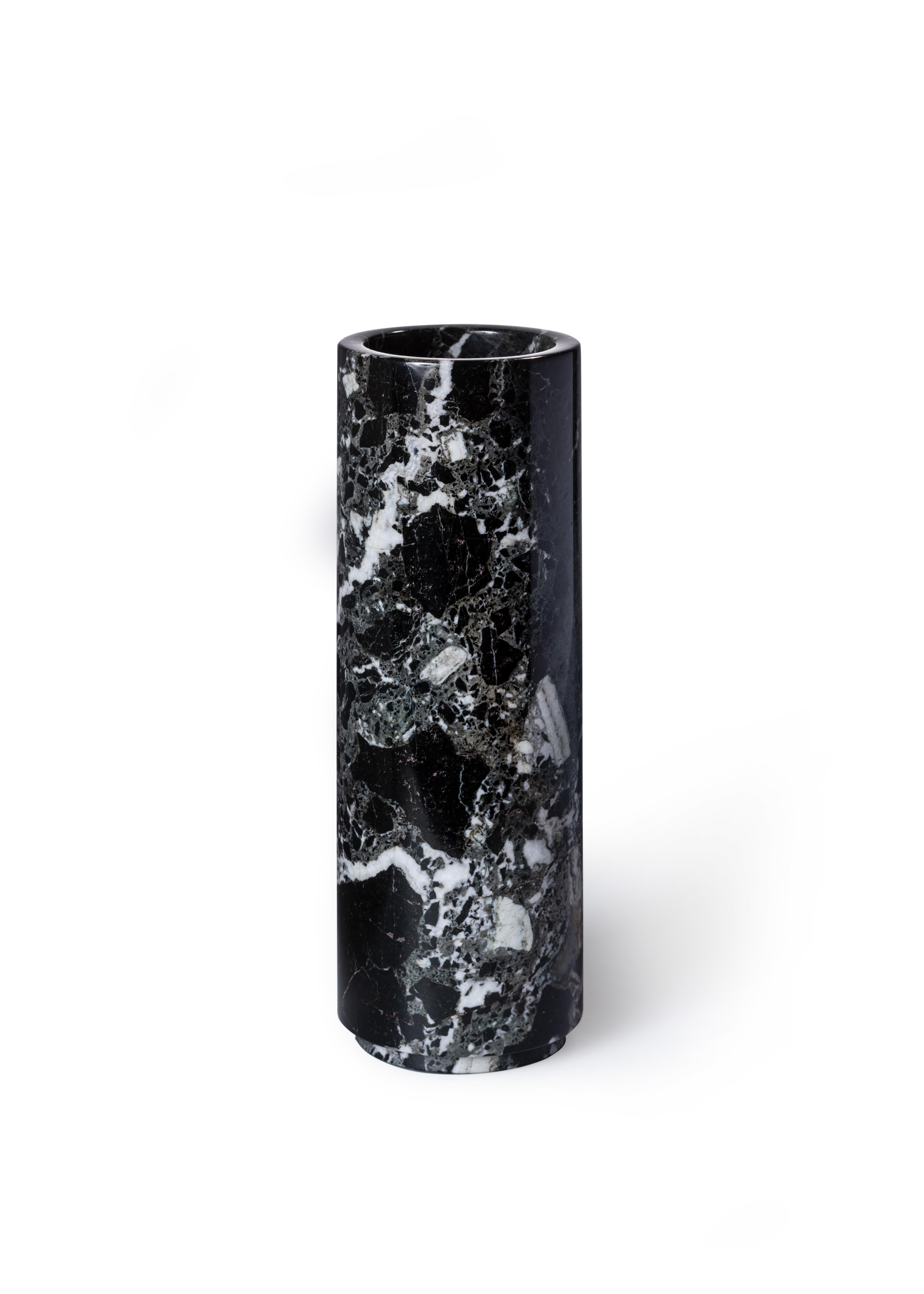 Handcrafted with precision, this vase is inspired by mid-century marble design objects, exuding understated luxury with its sleek simplicity. Eschewing unnecessary embellishments, it embraces clean lines and a timeless aesthetic that effortlessly